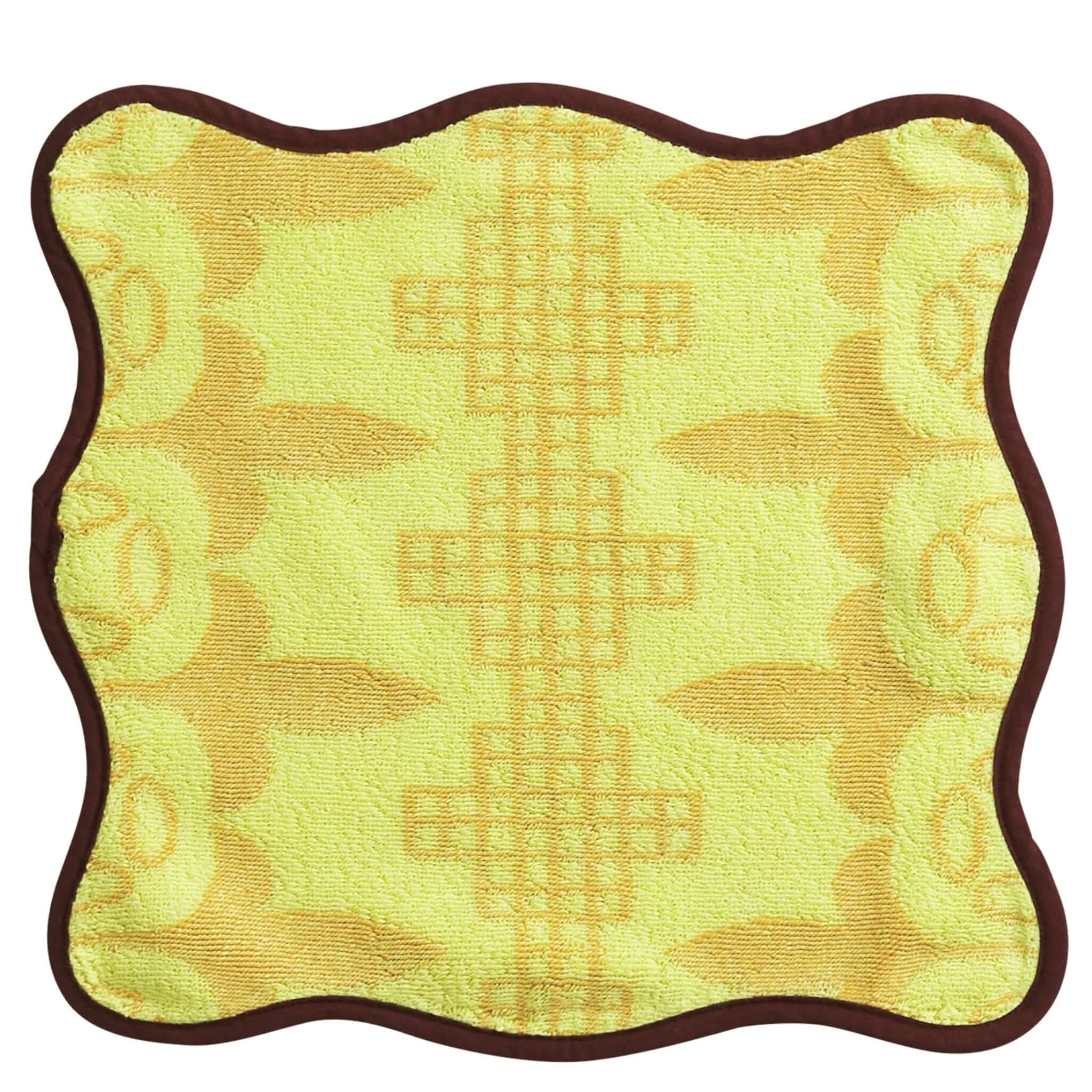 Yellow textured face cloth with brown border on a white background