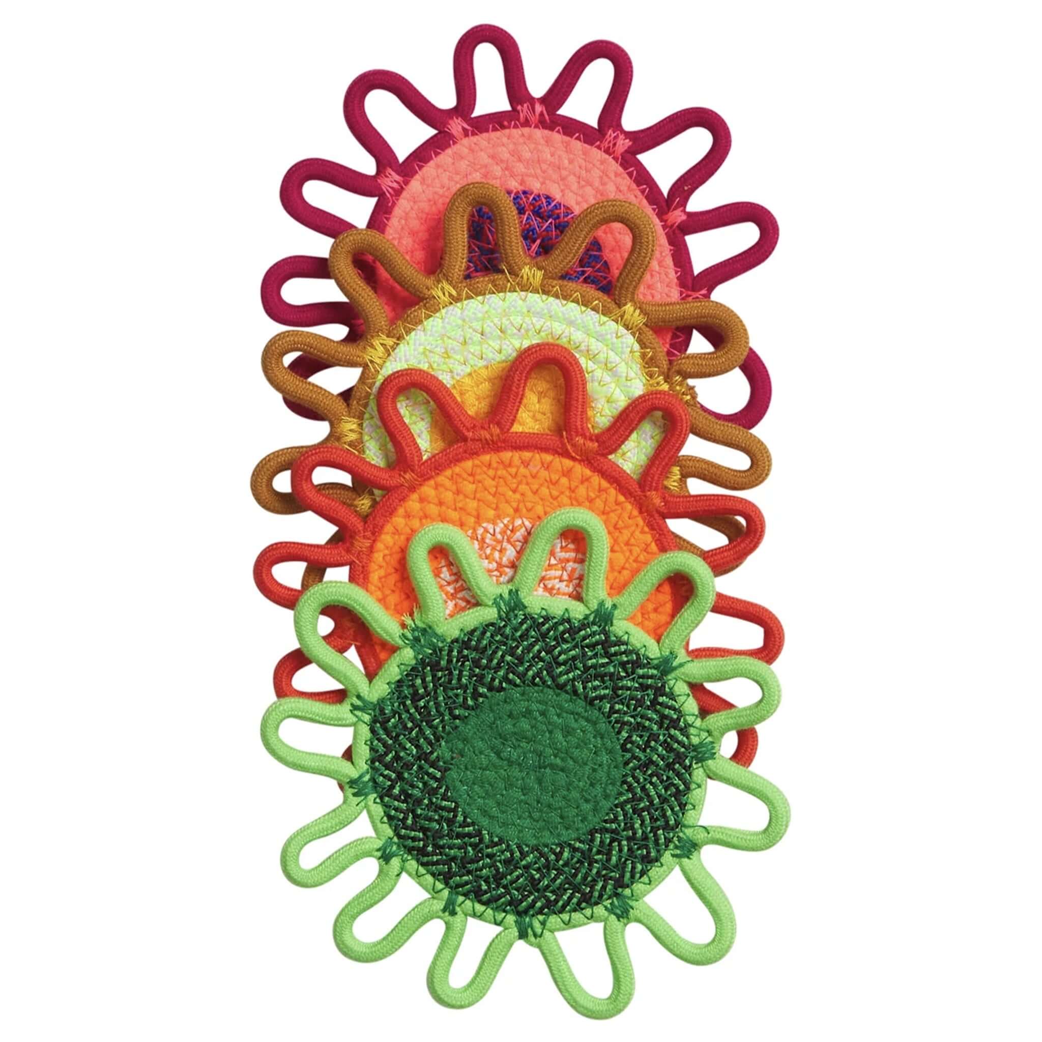 Colorful embroidered flower coasters with a white background