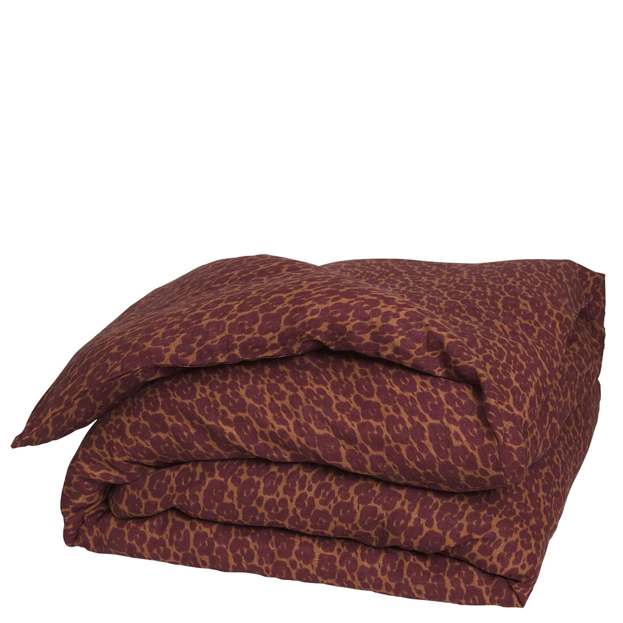 A folded linen duvet cover with a leopard-like print in a mix of brown and red colors.