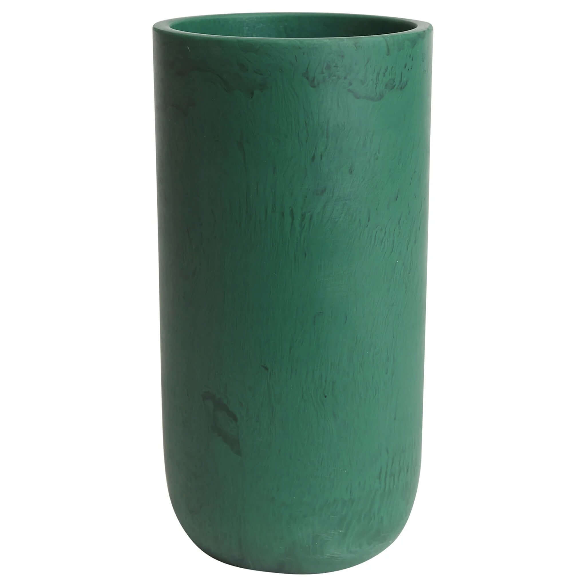A green cylindrical vase, the Sage x Clare Kalinda Vase, with a textured surface.