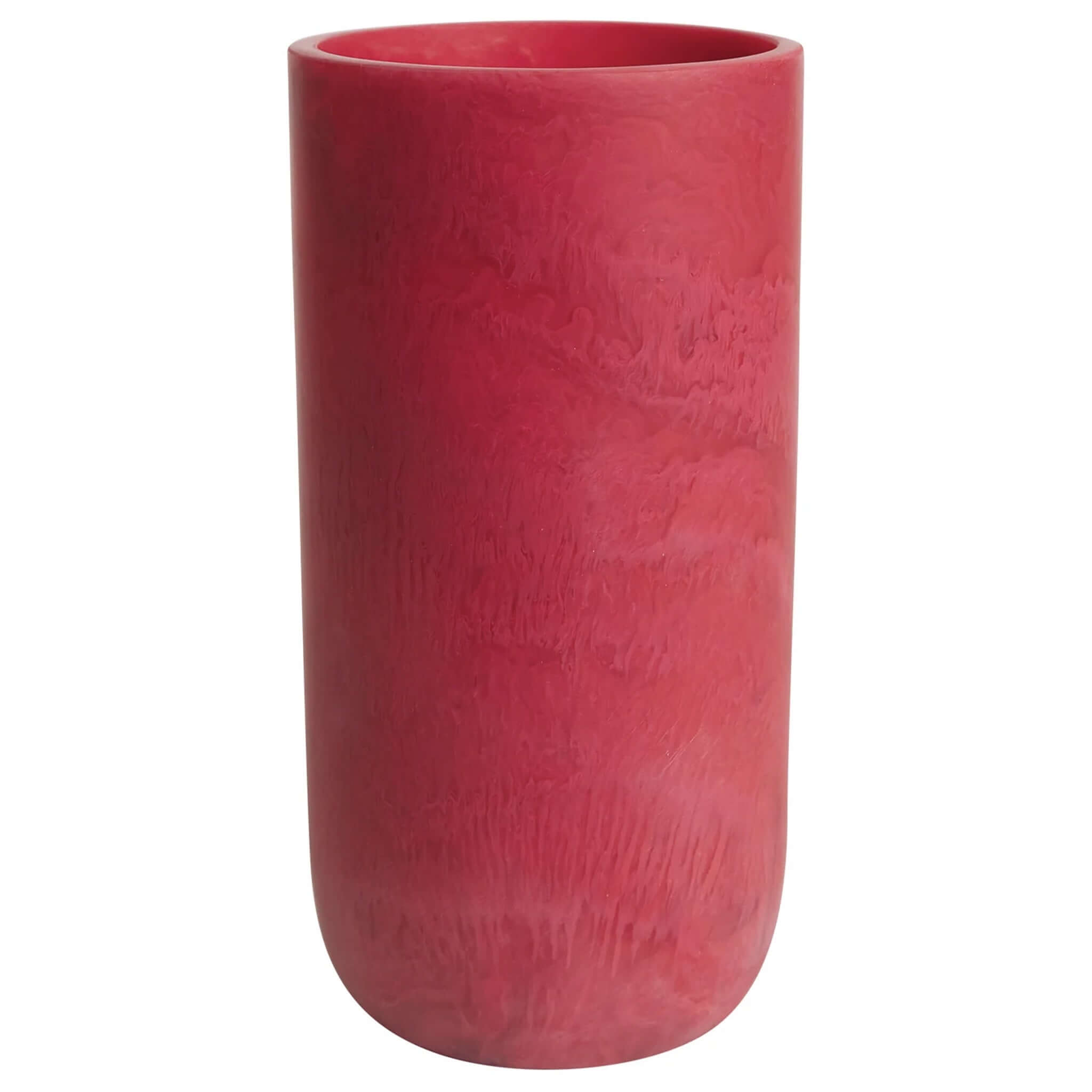 A red cylindrical vase, the Sage x Clare Kalinda Vase, with a textured surface.