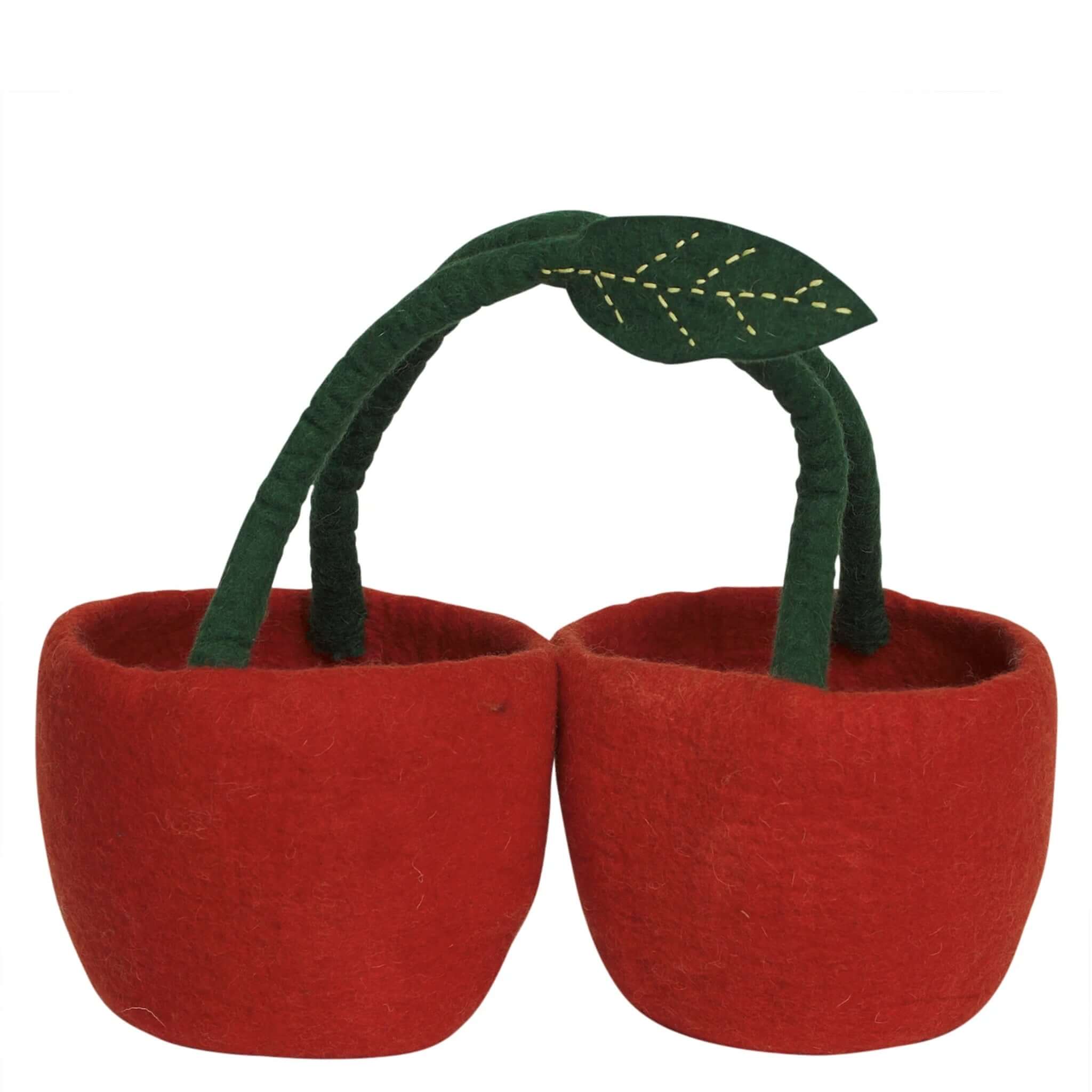 Red felt apple-shaped baskets with green handles on a white background