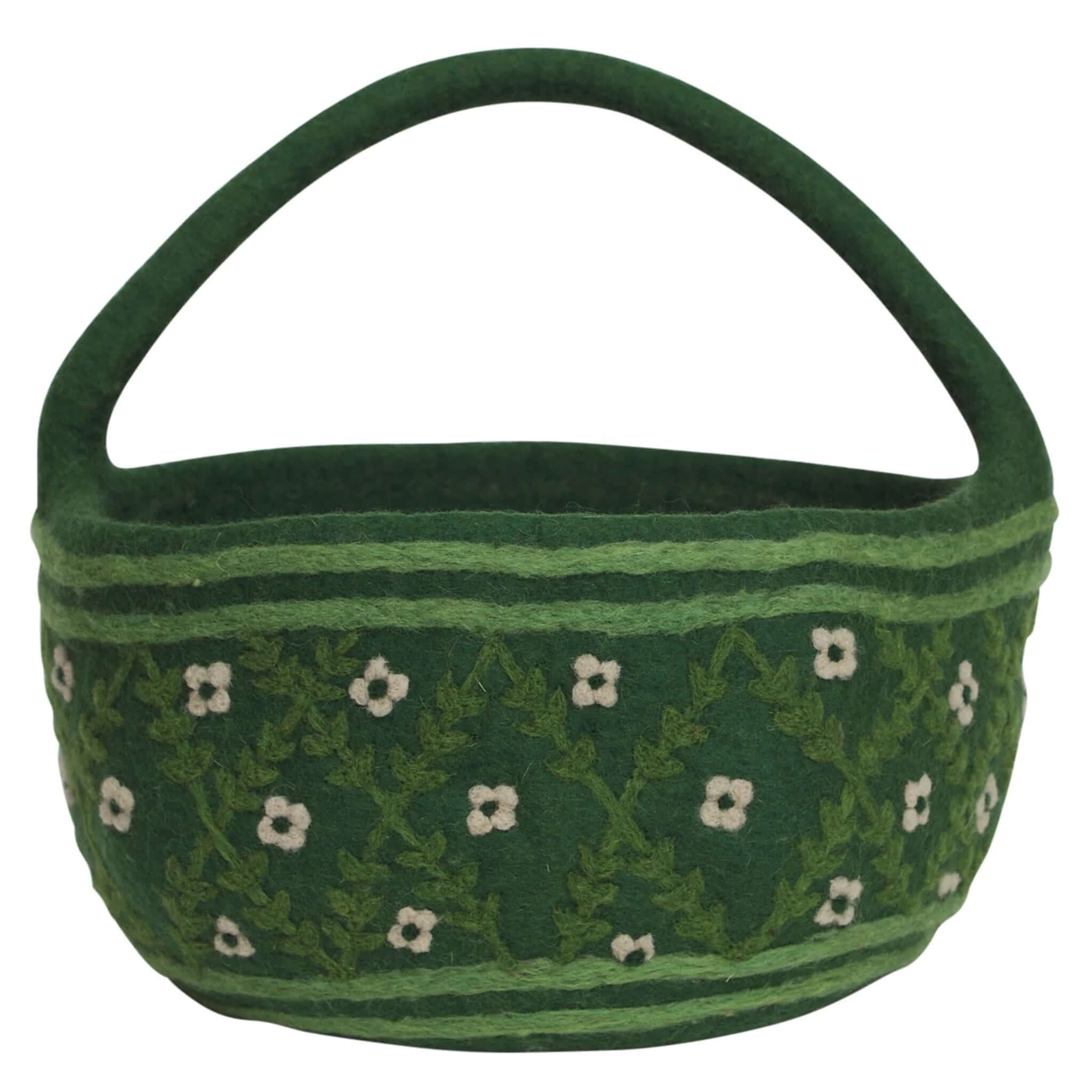 Green patterned basket with a handle on a white background
