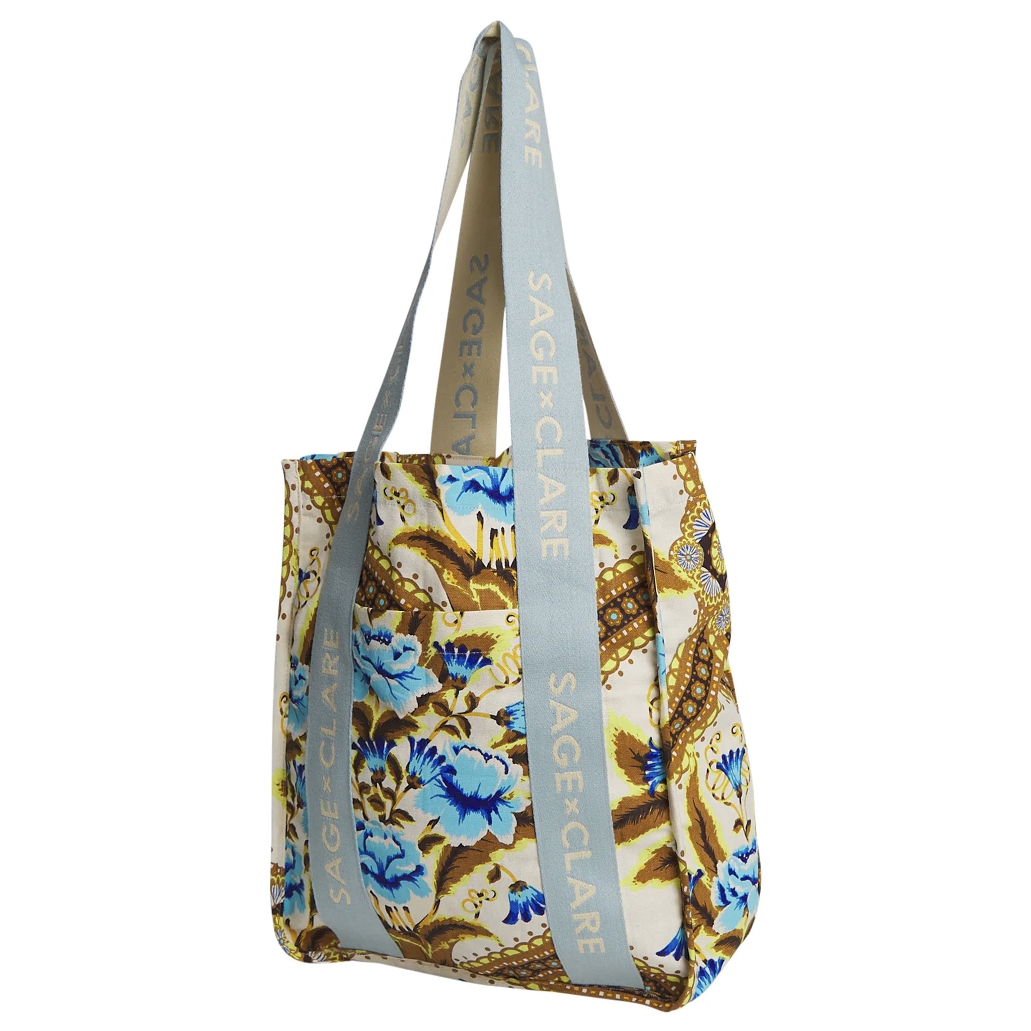 Floral patterned tote bag with 'SAGE & CLARE' branding on straps against a white background