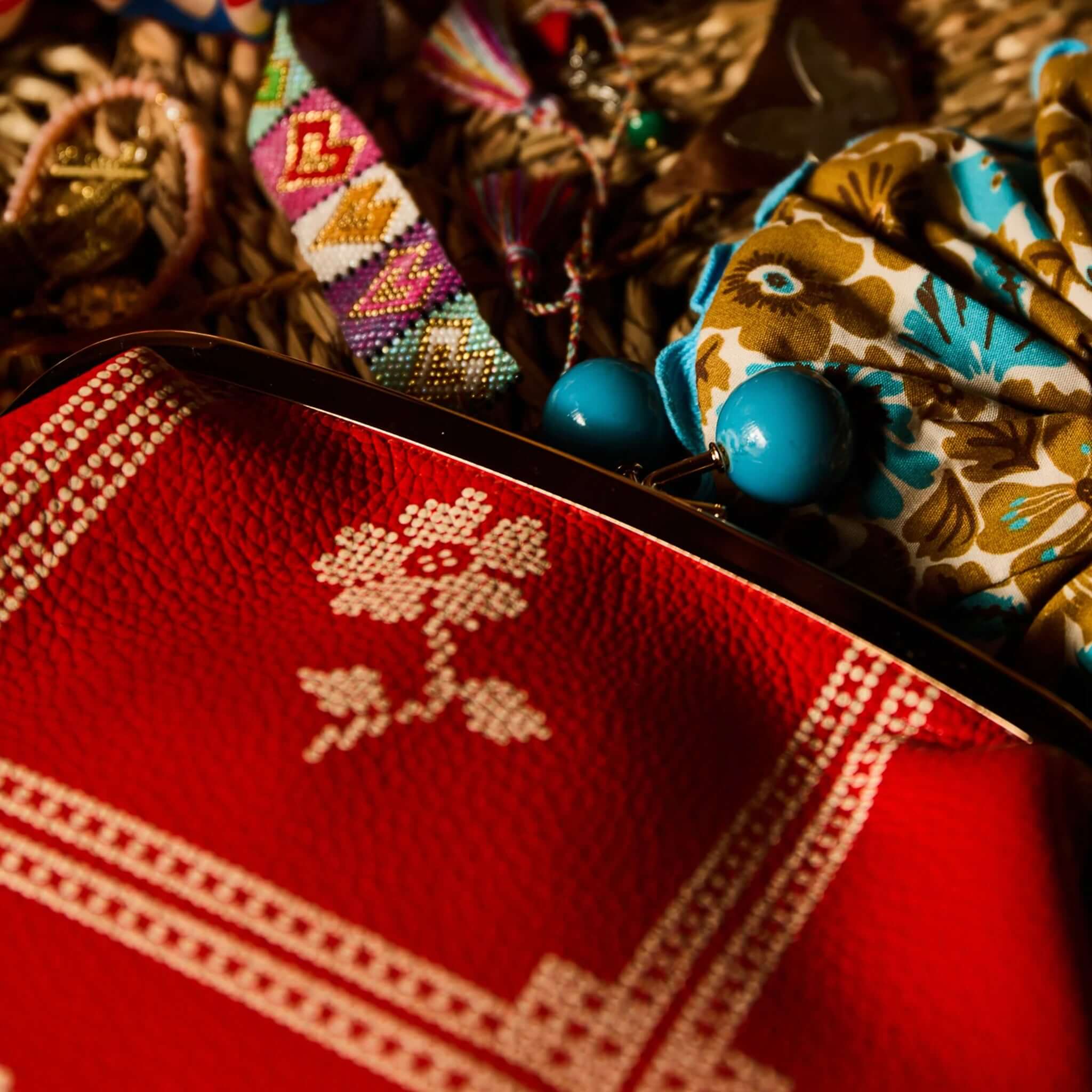 Sage x Clare Bonny Large Purse - Poppy with cream print and teal clasp on colorful accessories.
