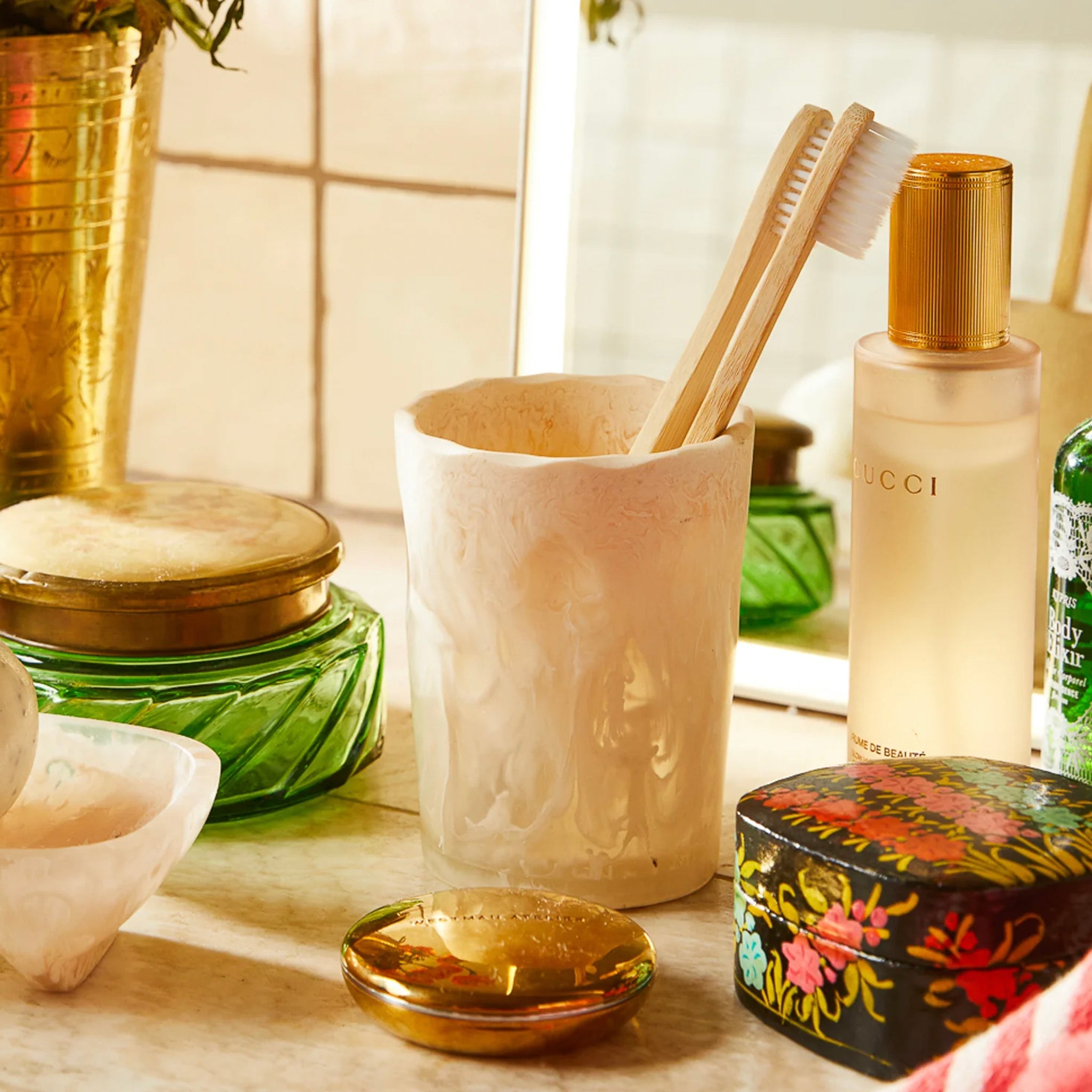 A white resin drinking vessel with an irregular, organic shape.