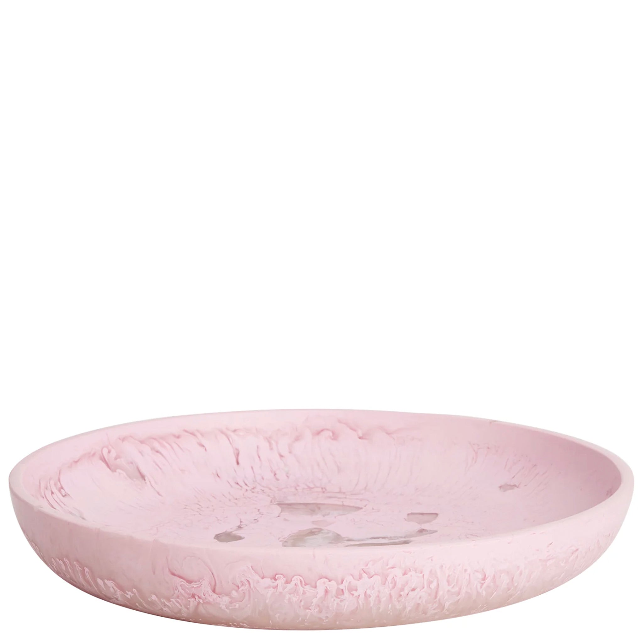 A pink, round, resin serving platter with a smooth surface.