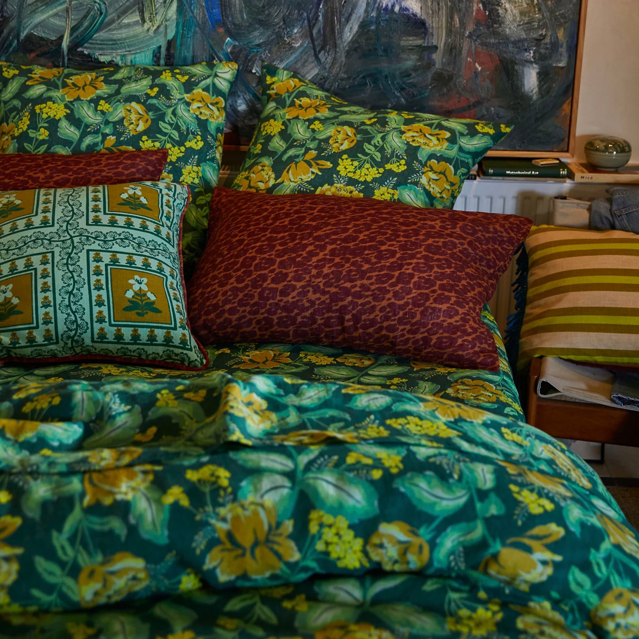 A brown leopard patterned linen pillowslip with a solid pattern on a bed.