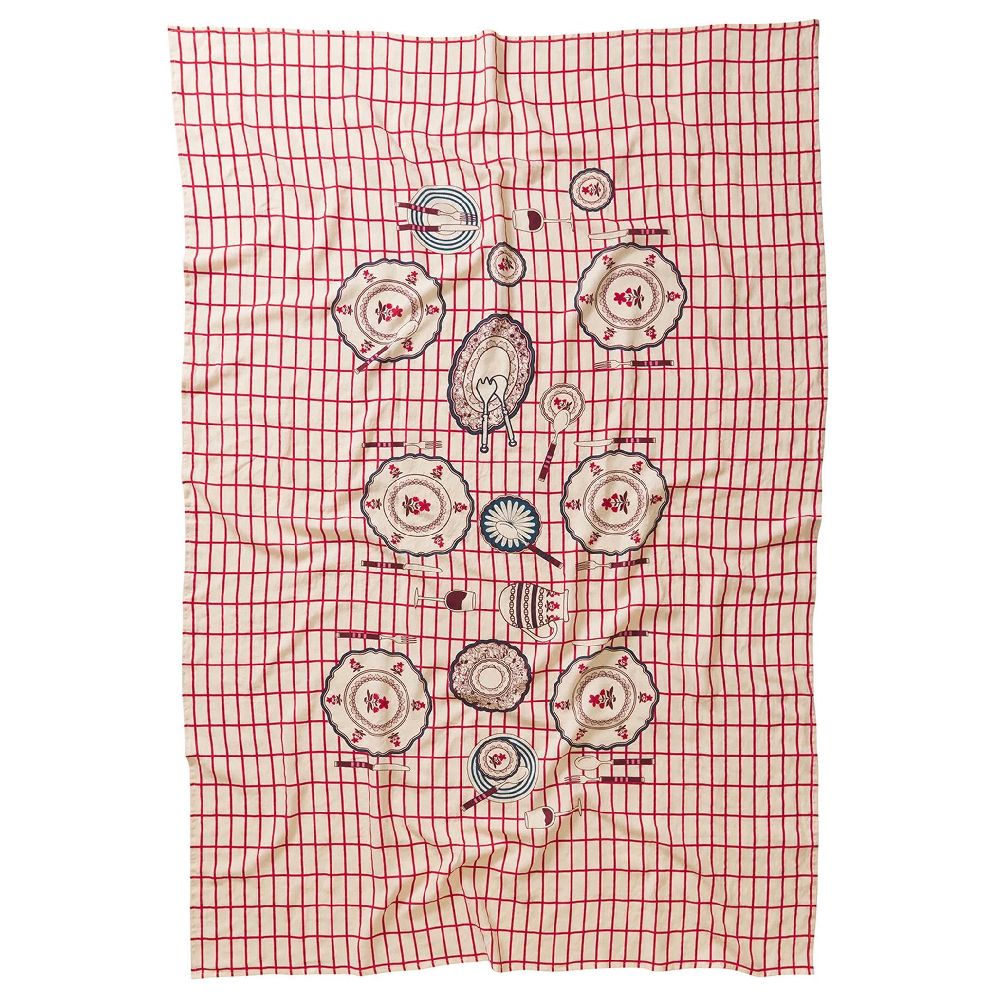 A red and white checkered tablecloth with floral and geometric patterns in the center laid out flat.