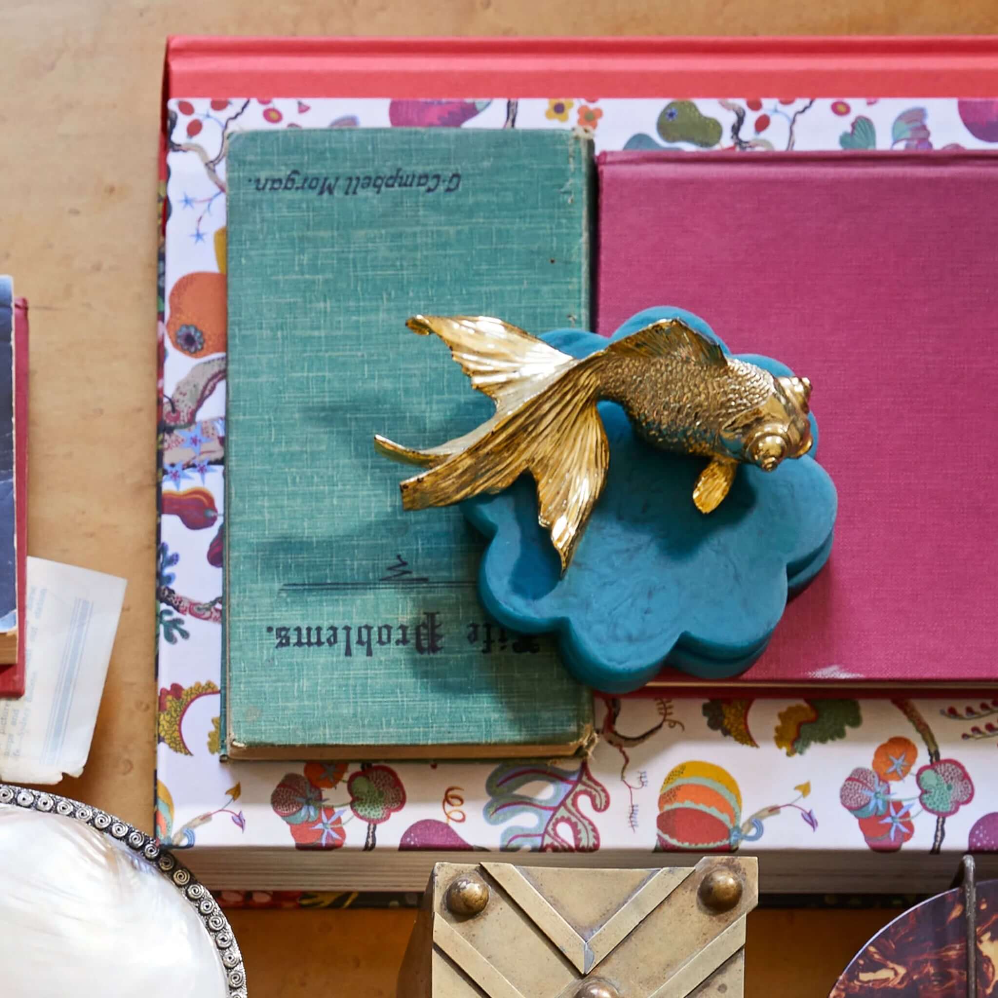 Teal resin coasters in a flower shape