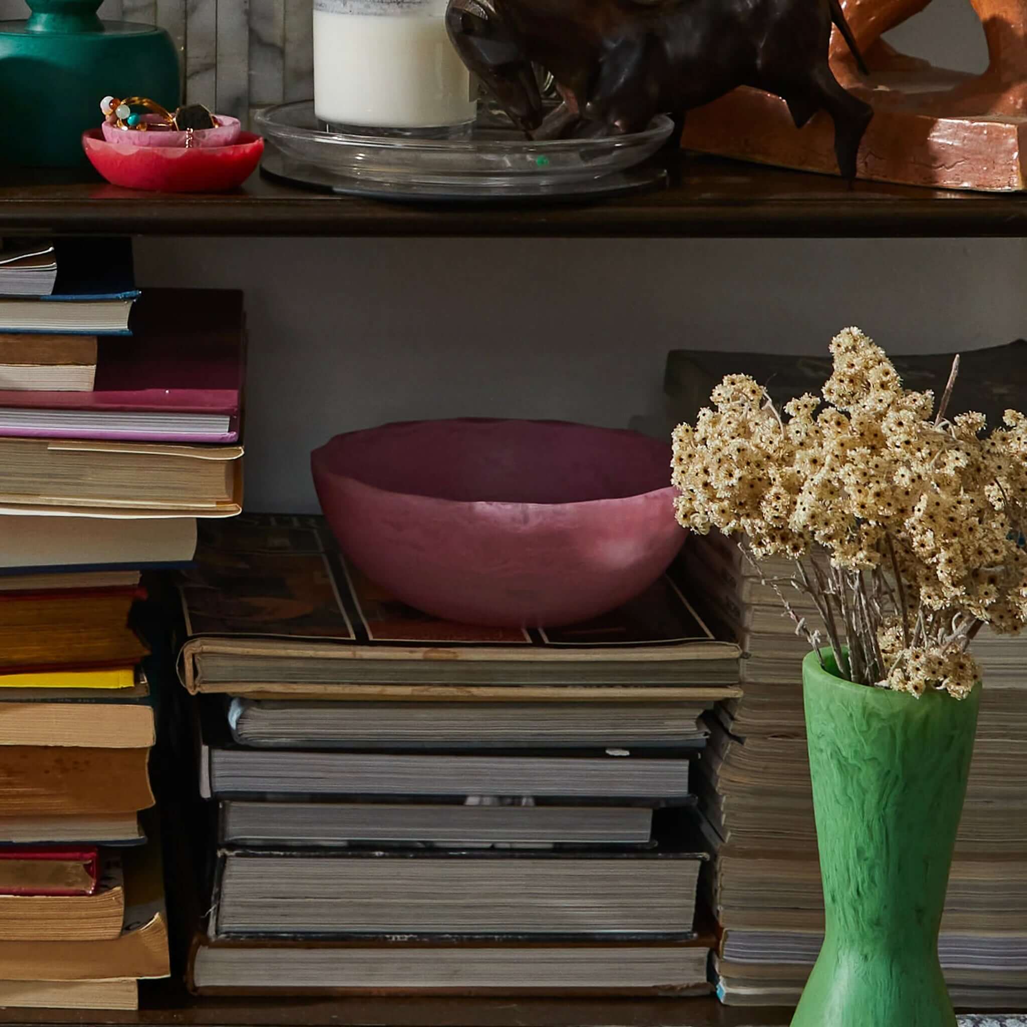 A round, pink resin bowl with a textured pattern, individually cast with moulds.
