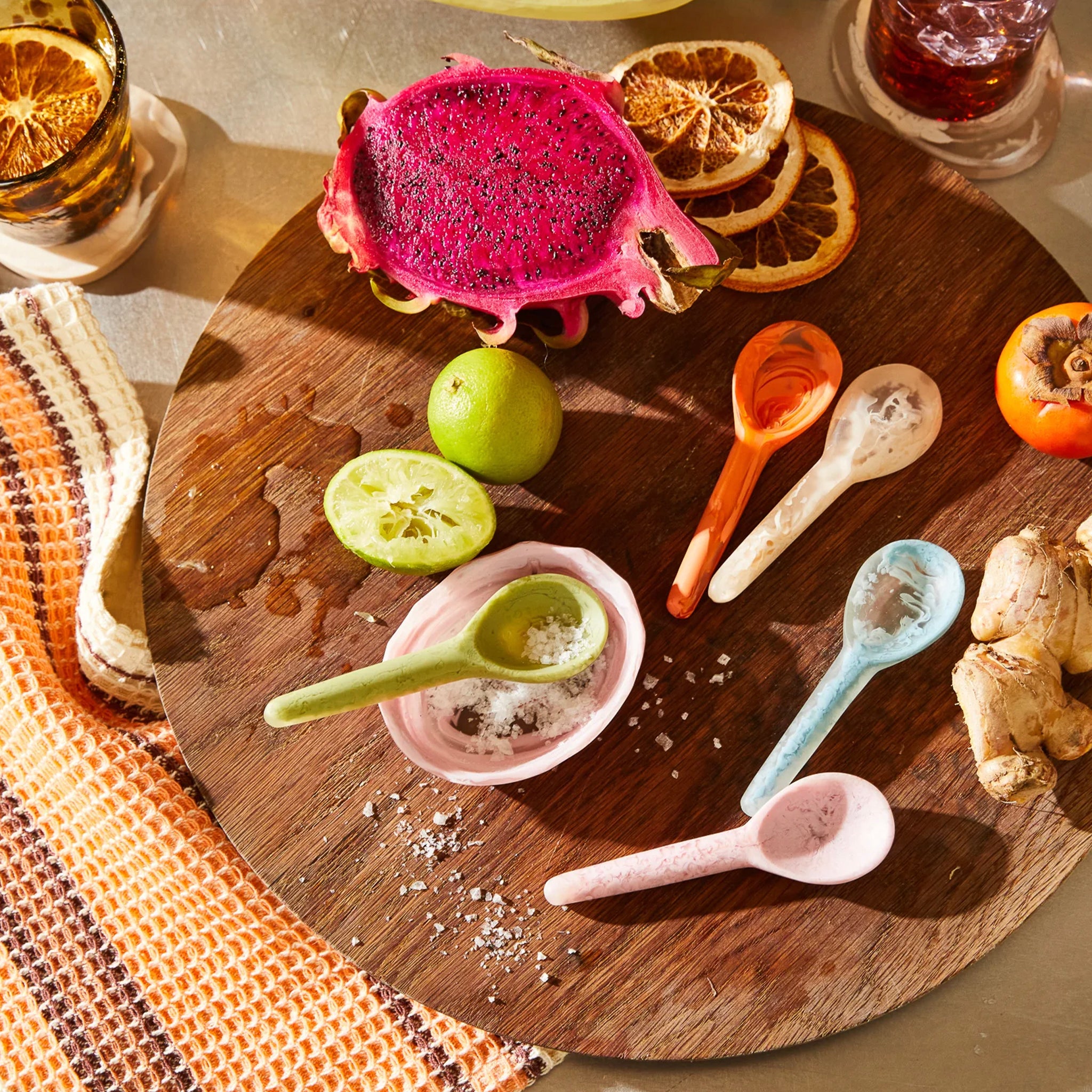 Colourful resin spoons on a platter.