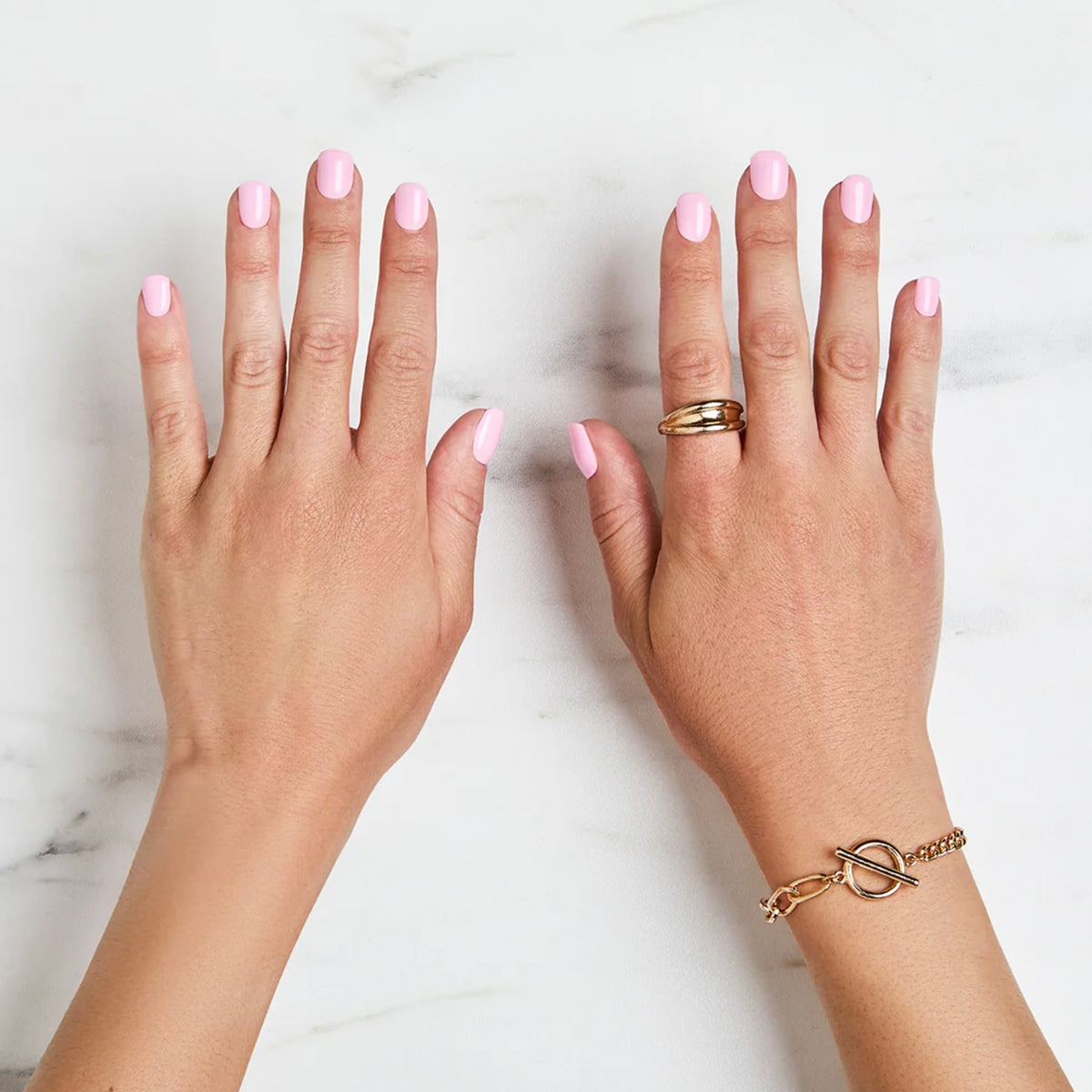Finished glossy pink manicure on both hands