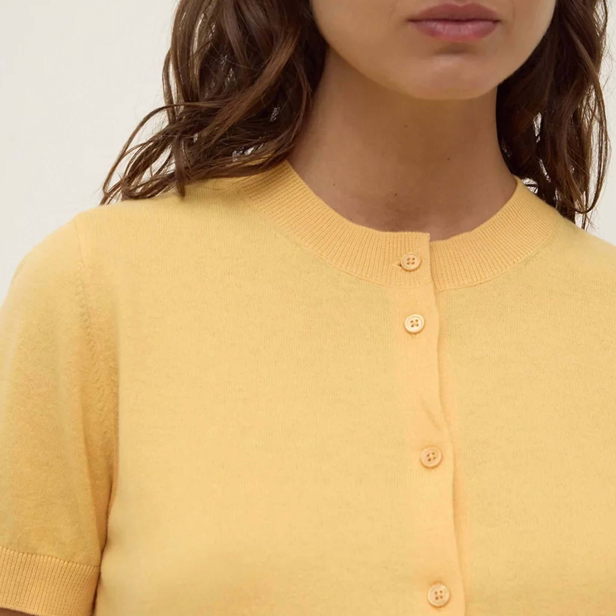 Alt Tag: Assembly Label Semra Cotton Cashmere Short Sleeve Cardigan - Sol, close-up of Sol yellow button-front cotton-cashmere knit