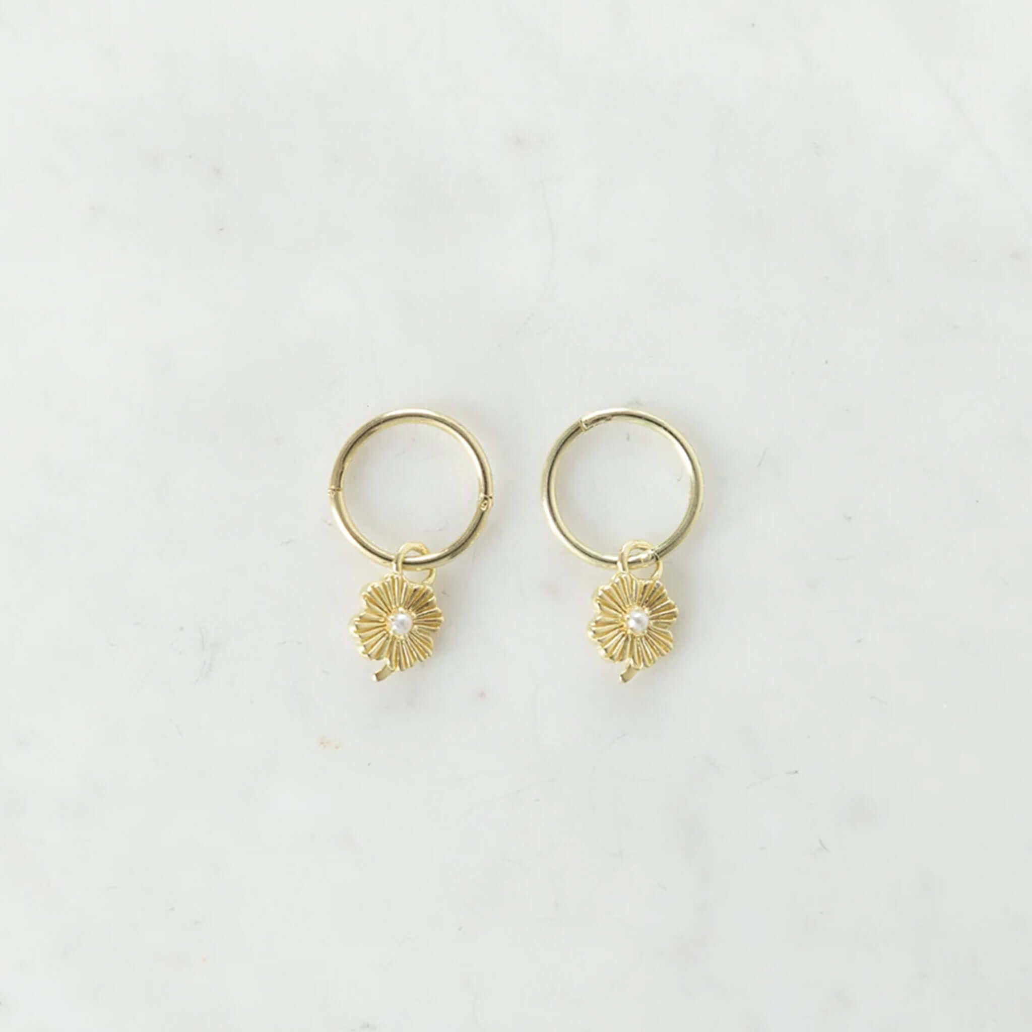 Alt Tag: Sophie Love Lily Sleeper Earrings in 14kt gold plated sterling silver with pearl lily pendant on 8mm sleeper hoop