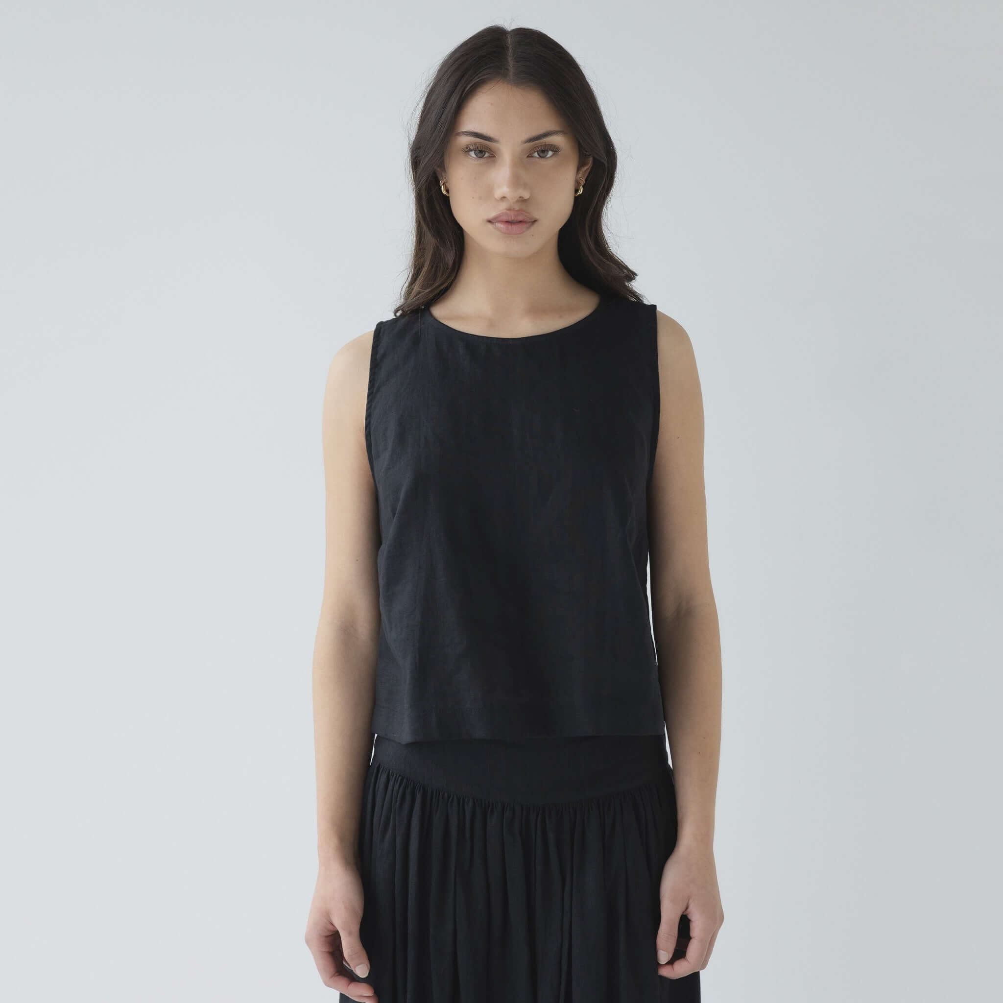 Alt Tag: Sophie Shell Buttons Linen Top - Black sleeveless black linen top worn by model, lightweight breathable textured summer layering essential