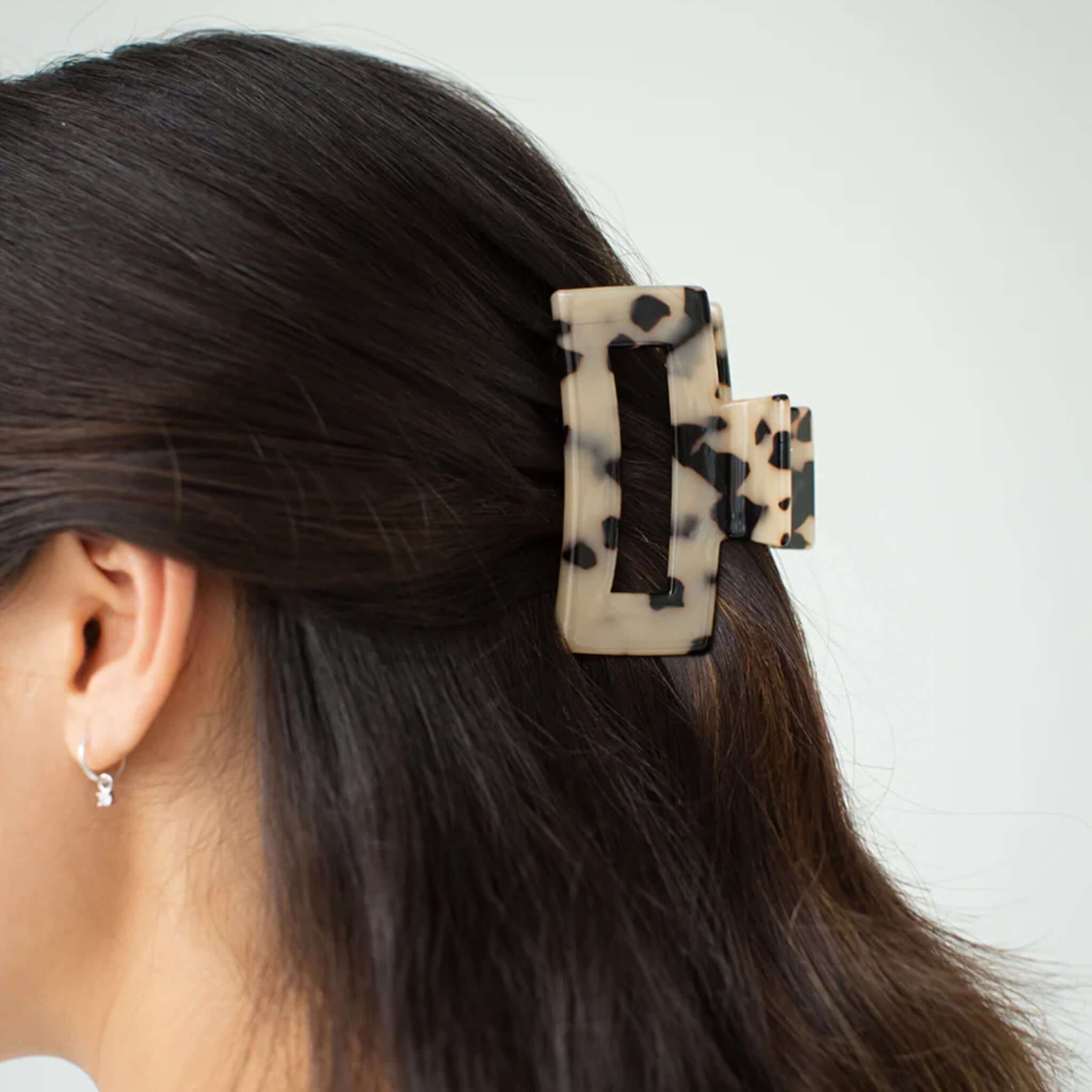 Alt Tag: Sophie Claw Clip Medium - Light Tort acetate claw clip in light tortoise, medium 3cm x 8cm hair accessory worn in dark hair