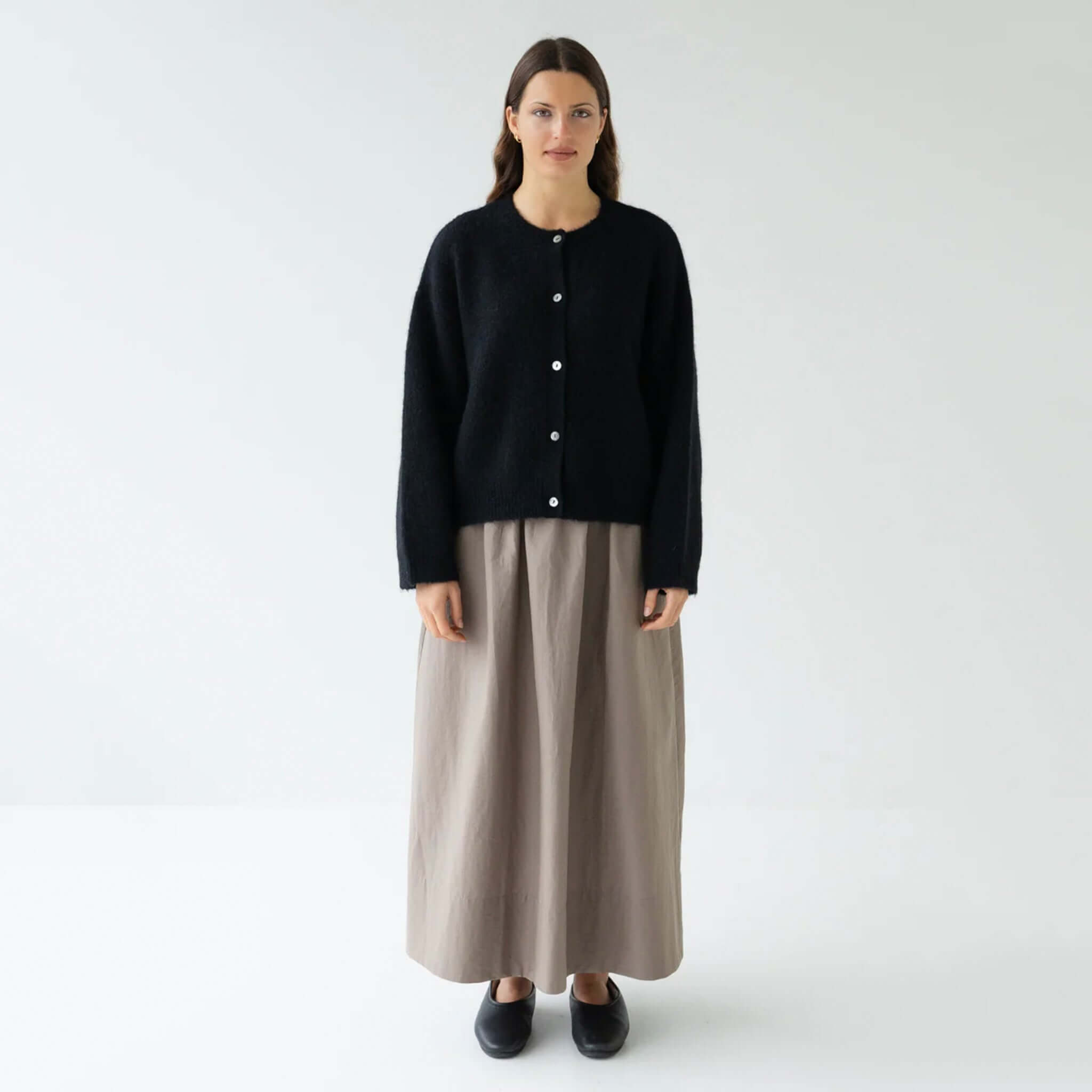 Alt Tag: Sophie Alpaca & Merino Blend Cardigan - Black worn by model, boxy cropped knit cardigan with buttons, cosy alpaca merino blend