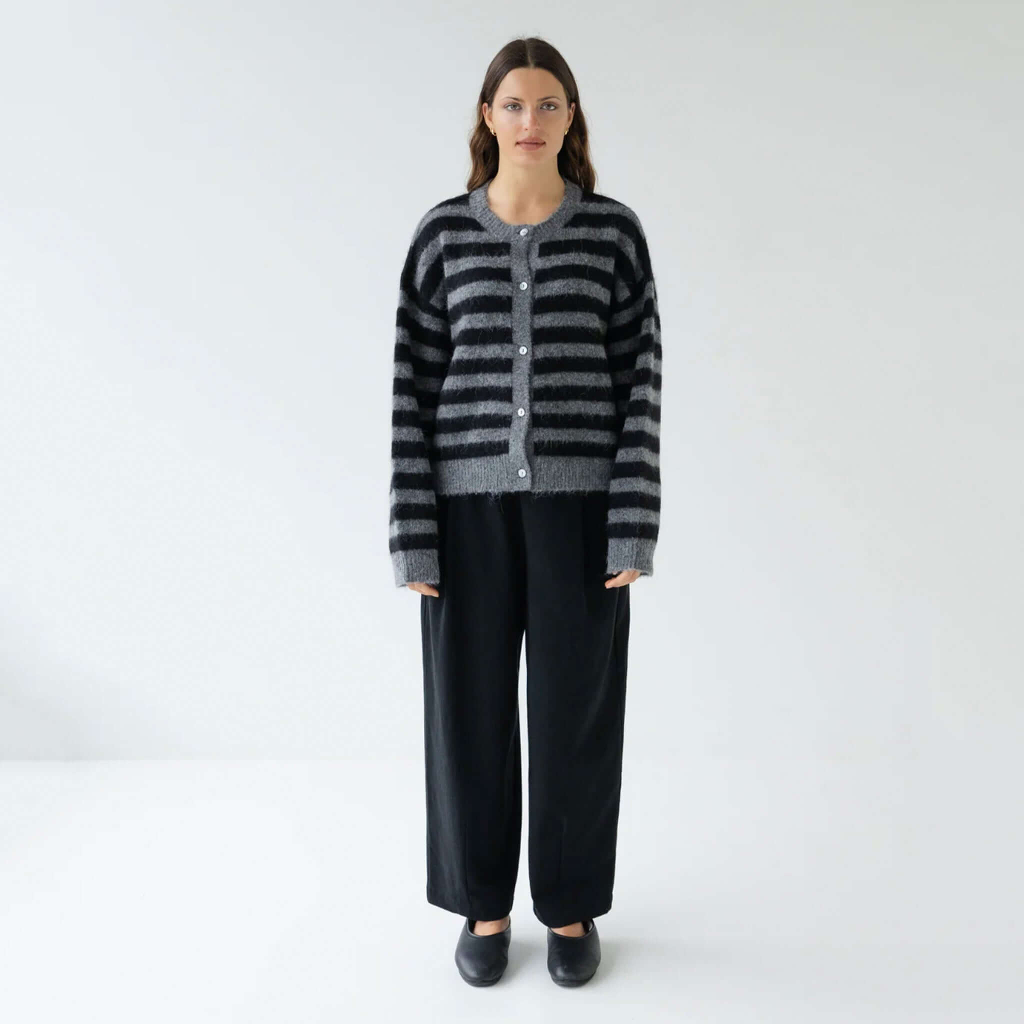 Sophie Alpaca & Merino Blend Cardigan - Graphite Stripe worn by model, boxy cropped striped knit cardigan styled with black trousers