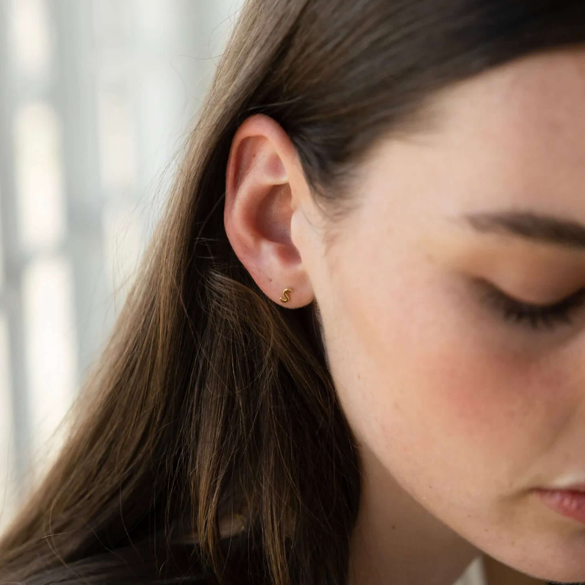 Alt Tag: Sophie Letter Stud Earring - 14K Gold Plated initial letter stud earring worn in ear, minimalist personalized jewelry gift