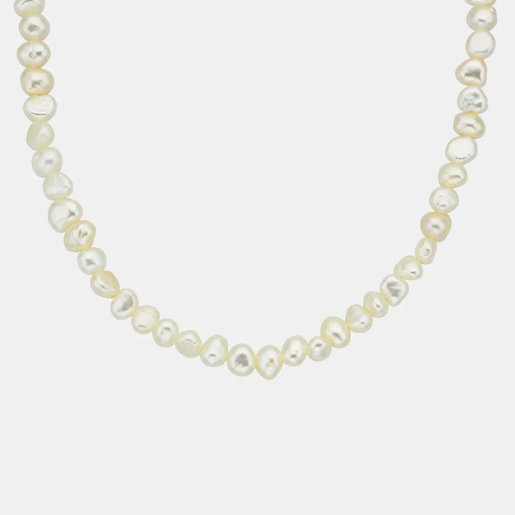 Sophie Pretty in Pearls Necklace featuring natural freshwater pearls, close to collarbone for elegant layering.