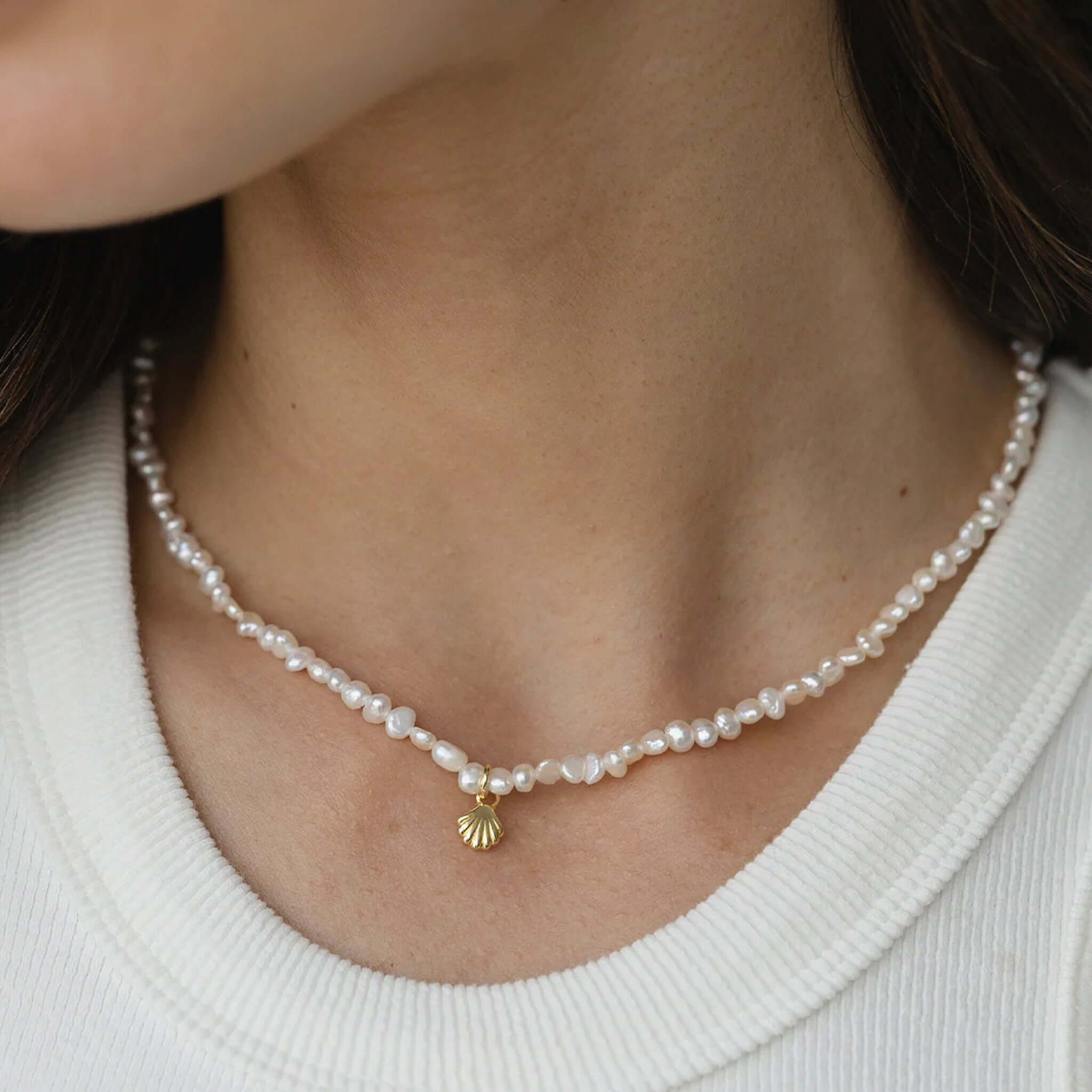Sophie Pretty in Pearls Necklace featuring freshwater pearls and a gold shell charm, perfect for layering.