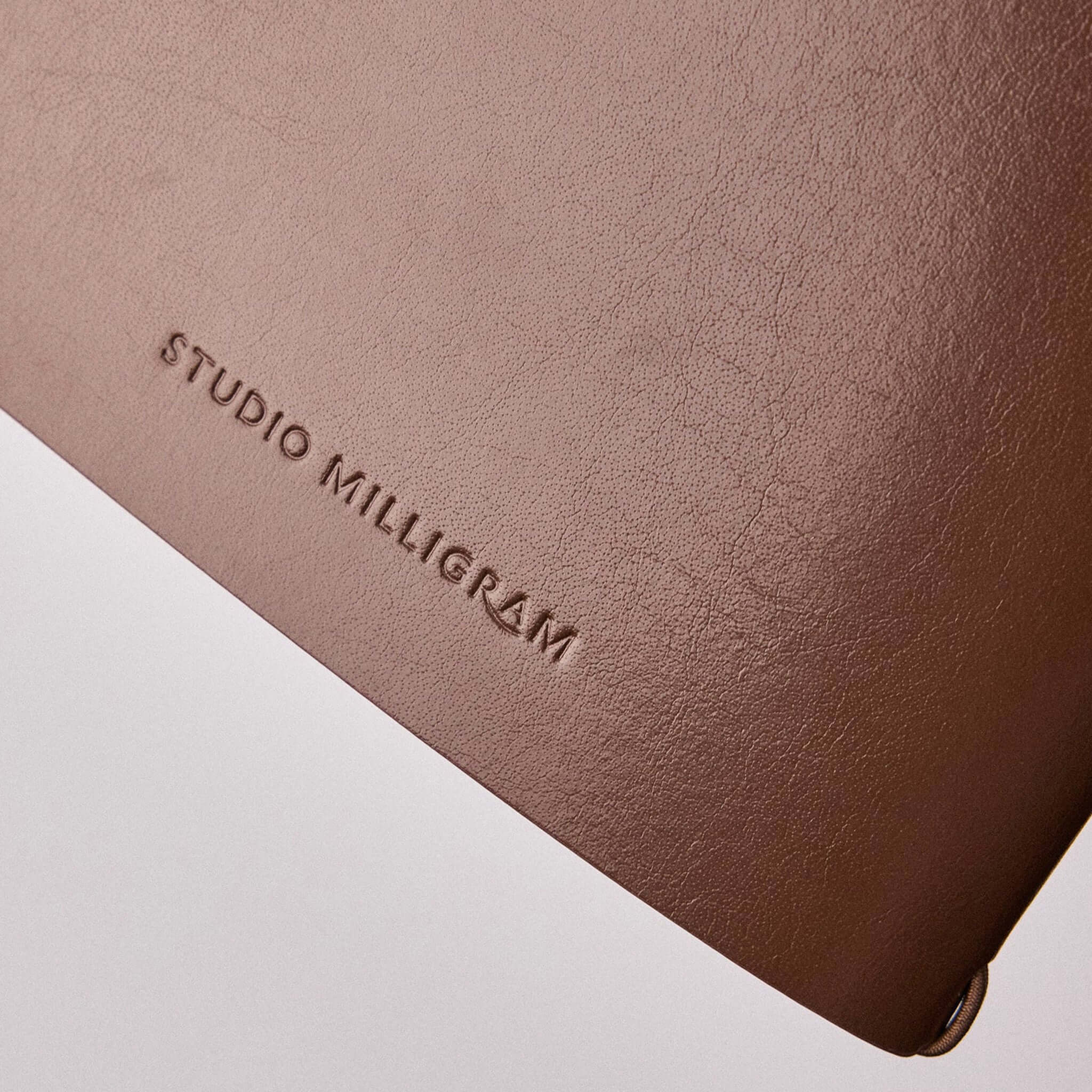 Milligram Recycled Leather Journal Set - Chocolate featuring a smooth recycled leather cover with embossed logo.