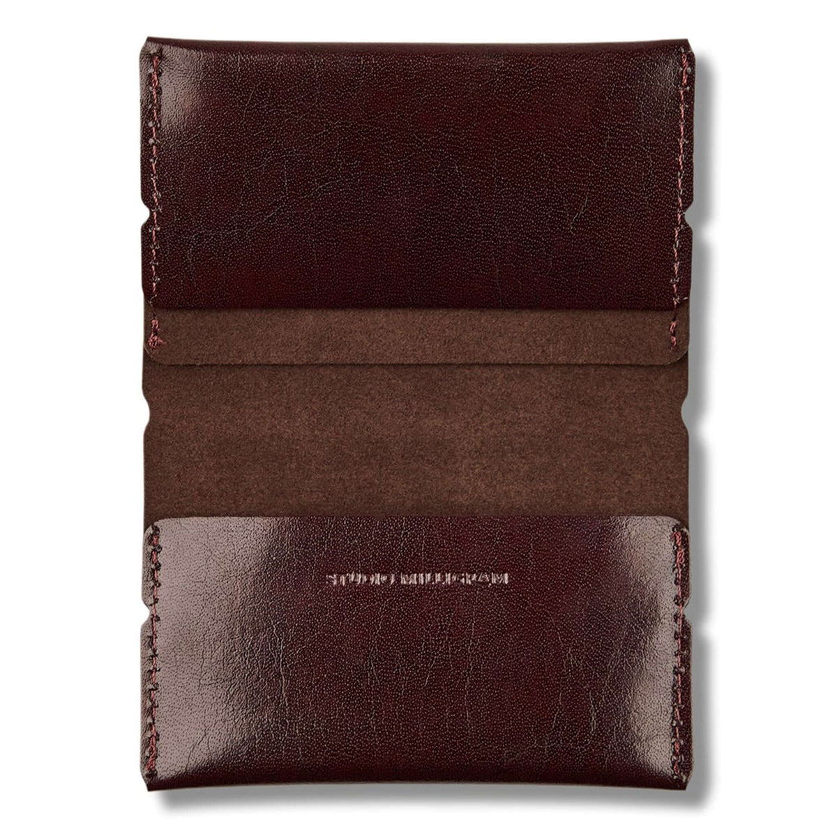 Studio Milligram Recycled Leather Card Wallet - Burgundy, showcasing the smooth recycled leather texture and compact design.
