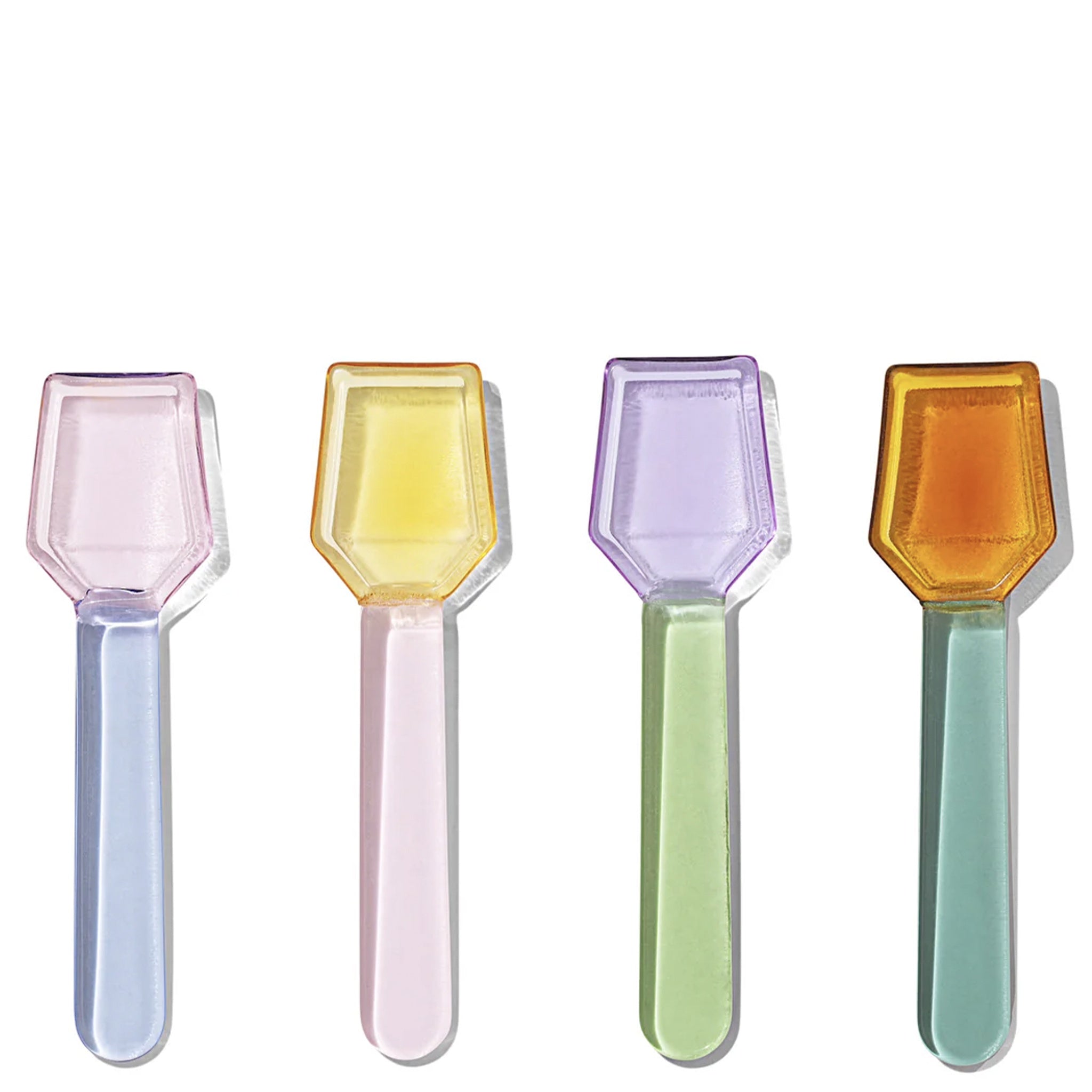 A set of four multi-colored glass spoons in a clear liquid, displayed horizontally.