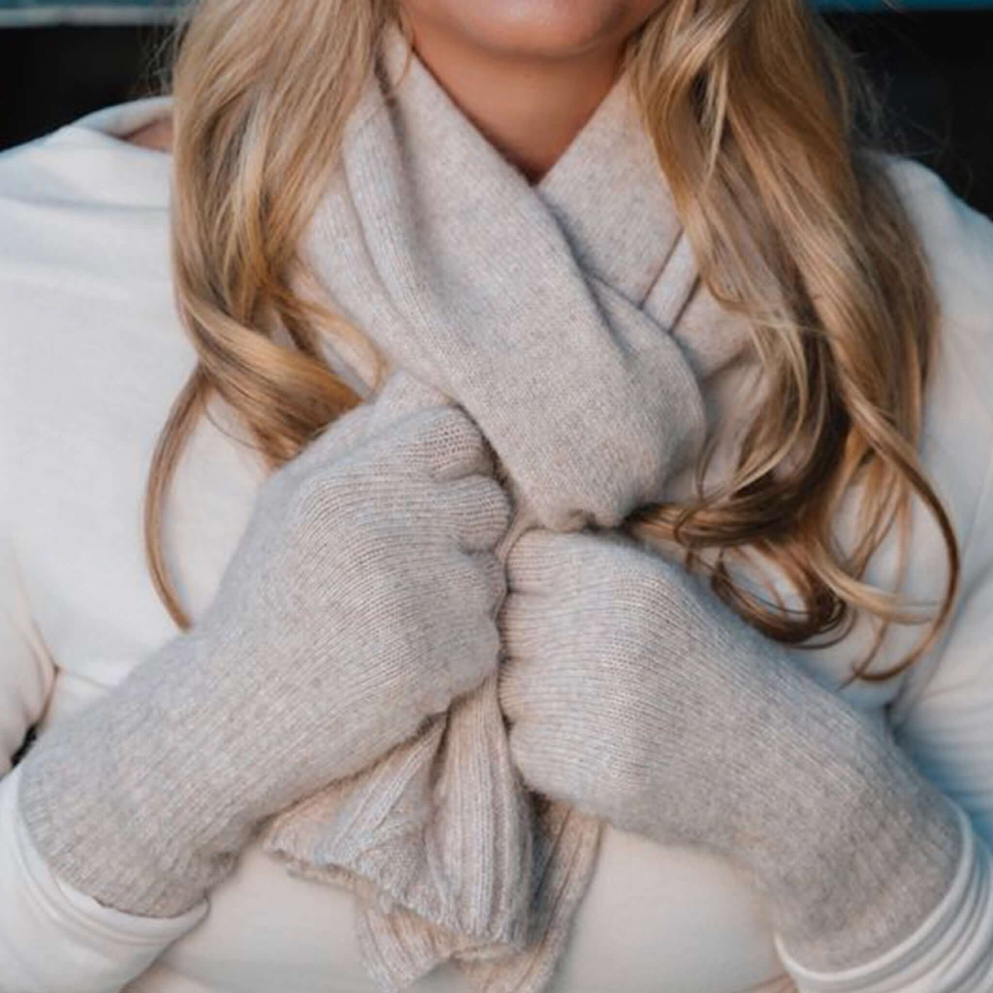 Sundaise Hotham Cashmere & Wool Gloves - Light Oat worn with a matching scarf, showcasing cozy elegance and warmth.