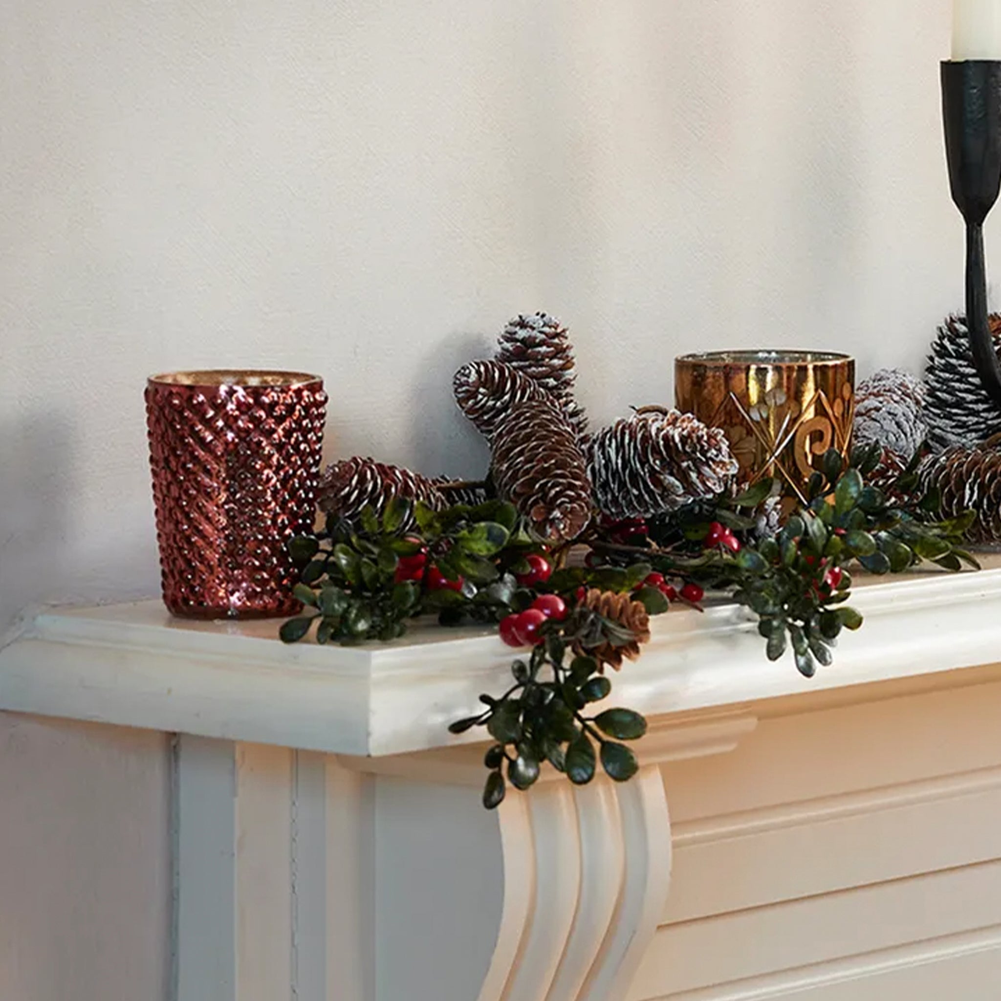 Flower Etched Copper Votive on a mantle.