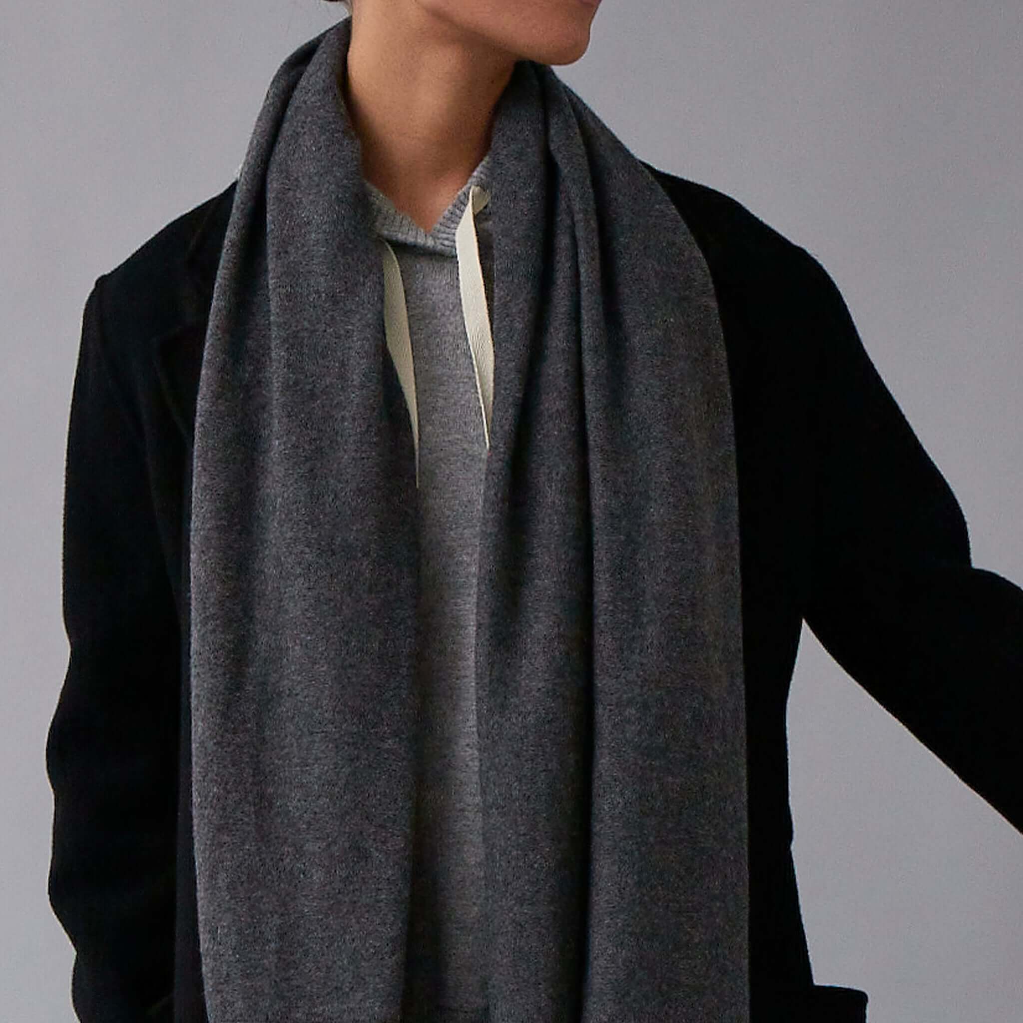 The Uniform Cashmere Oversized Scarf - Mushroom worn draped around neck, soft oversized cashmere scarf in elegant mushroom hue