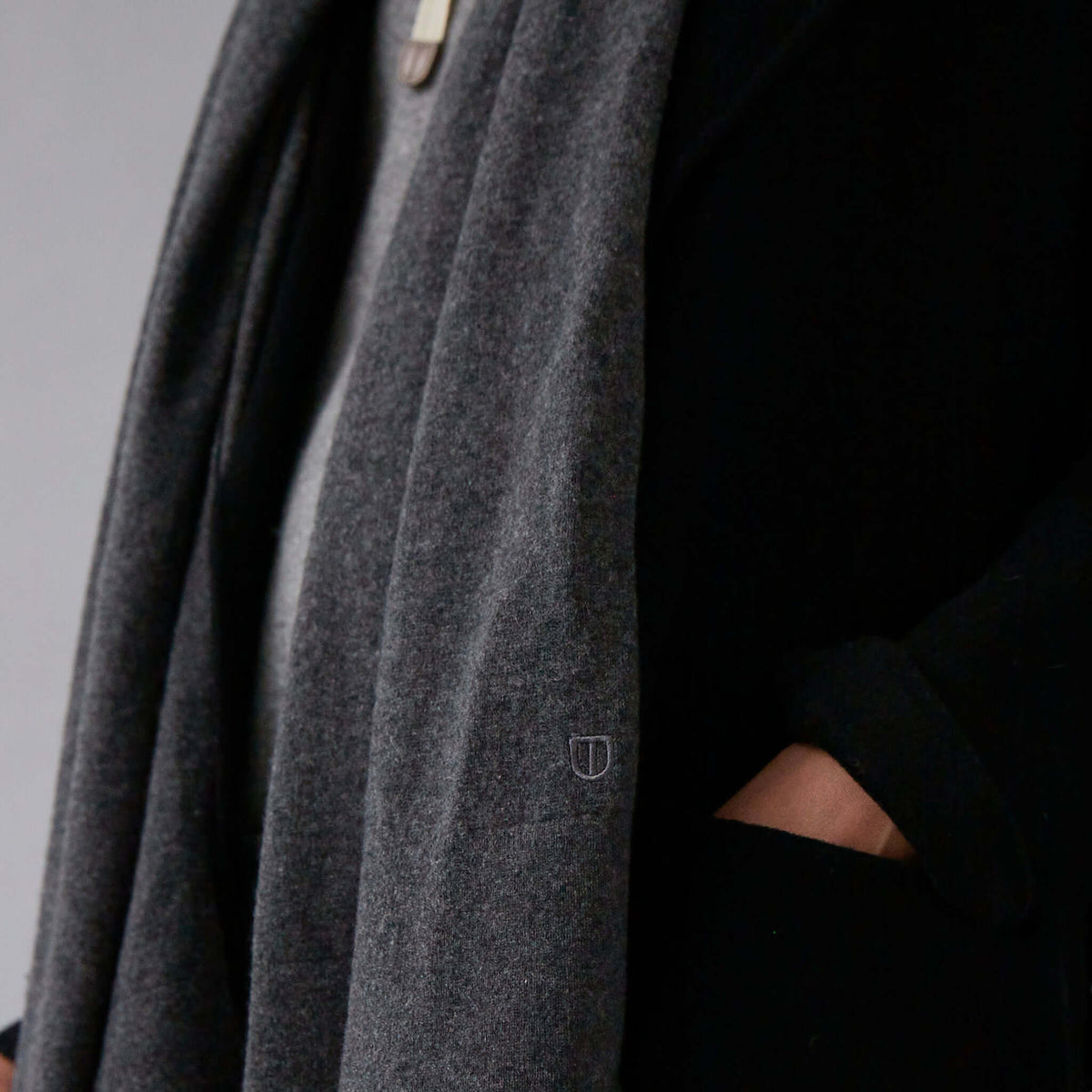 The Uniform Cashmere Oversized Scarf - Mushroom draped on model, ultra-soft oversized cashmere wrap for warmth and sophistication
