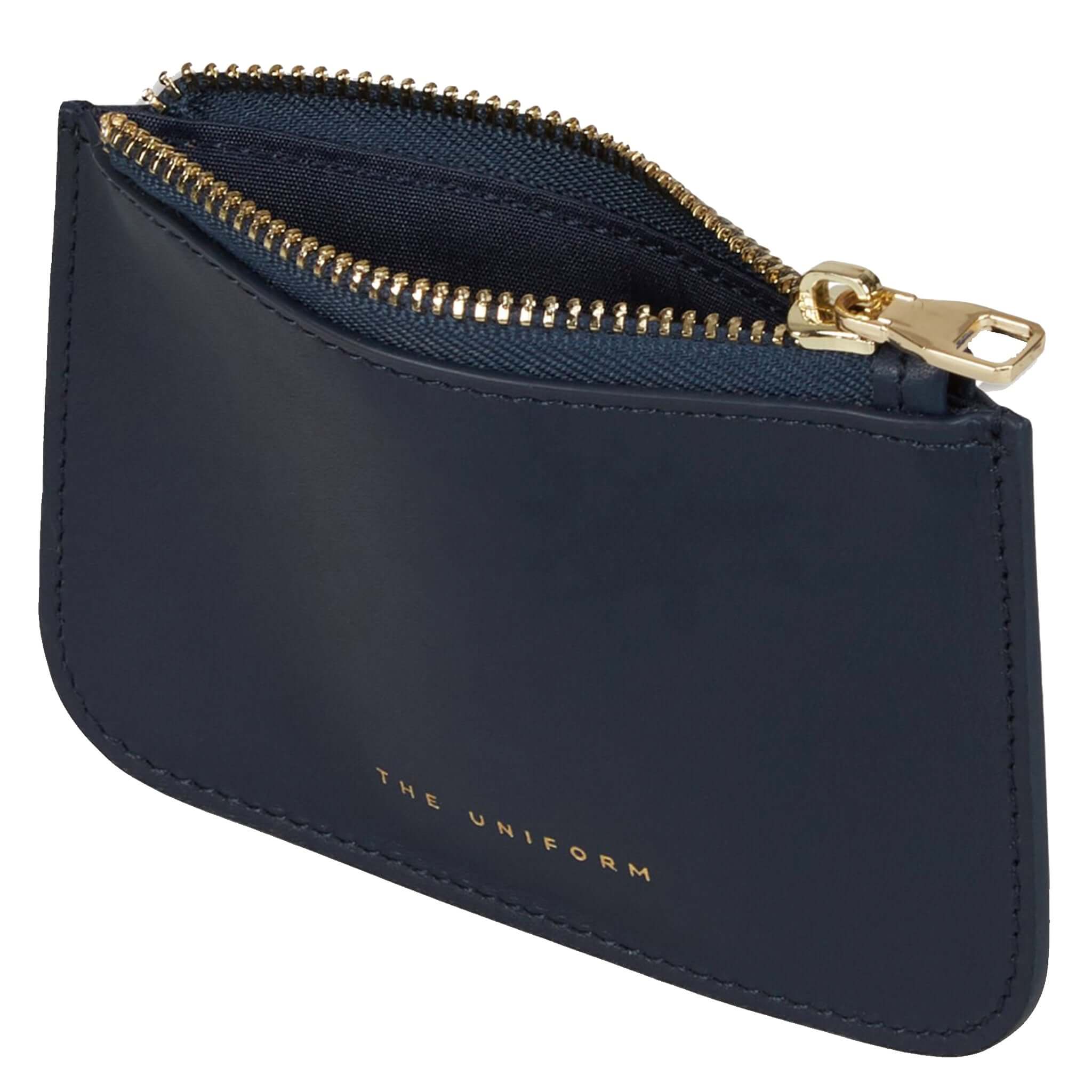 Alt Tag: The Uniform Wallet - Navy full-grain calf leather zip top wallet, navy lining and gold zipper, sleek London-made everyday wallet