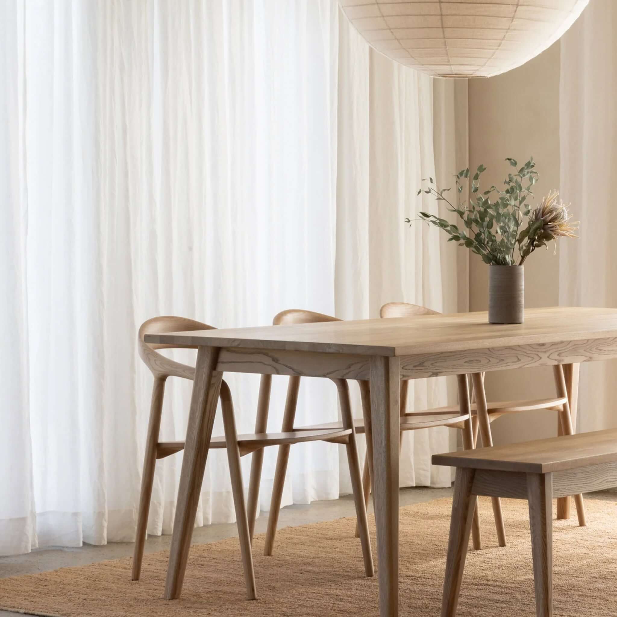 Vassa American Oak Bench Scandinavian bench seat with strong grain and smooth finish, shown in a contemporary dining room