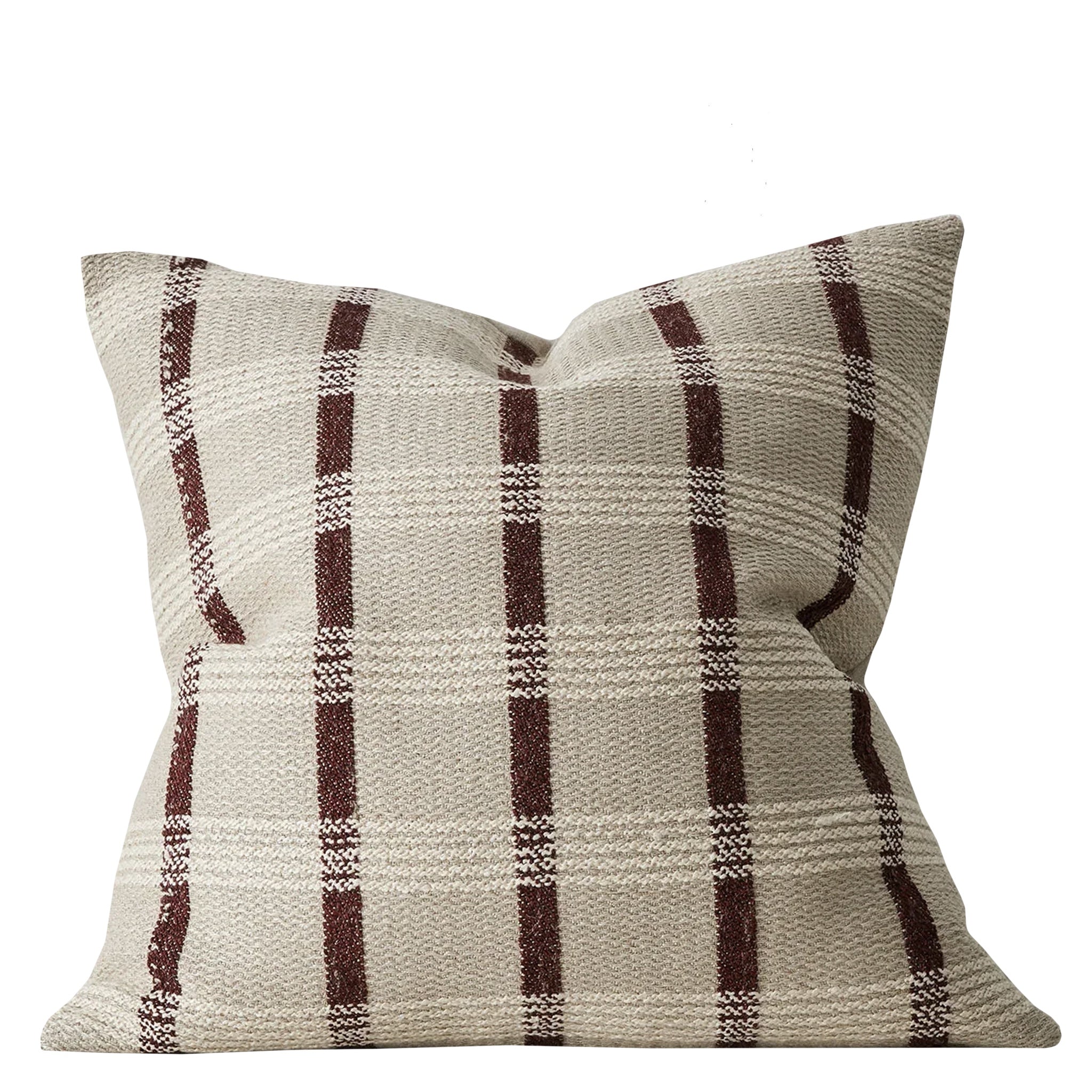 Plaid patterned pillow with brown and beige colors on a white background