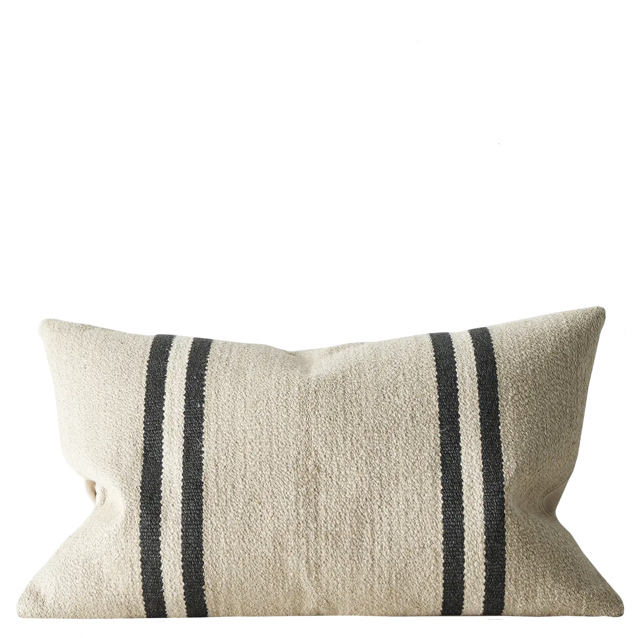 Beige cushion with black stripes on a white background