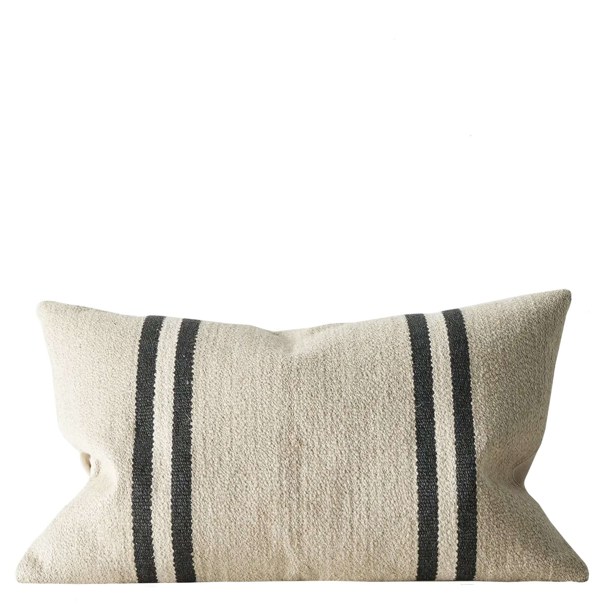 Beige cushion with black stripes on a white background