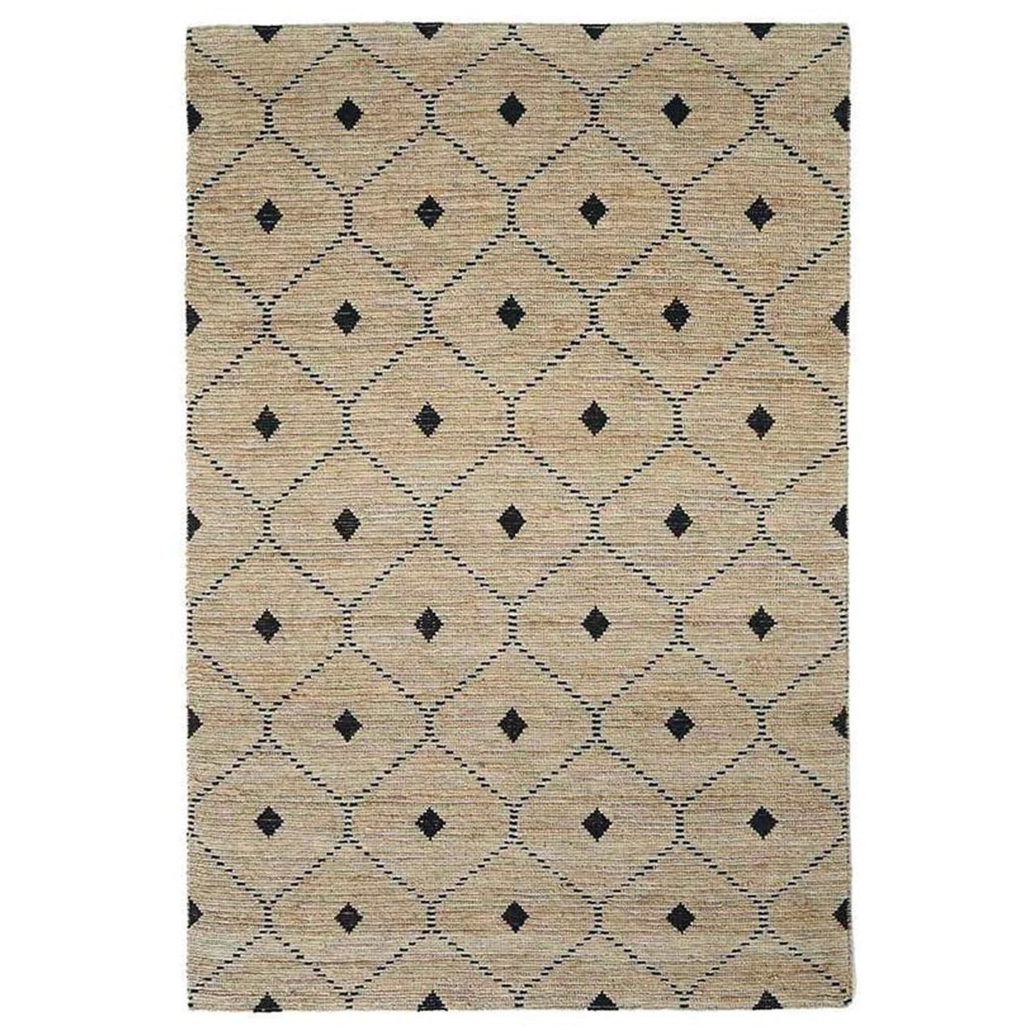 A rectangular, flatweave rug with a geometric pattern in beige and black