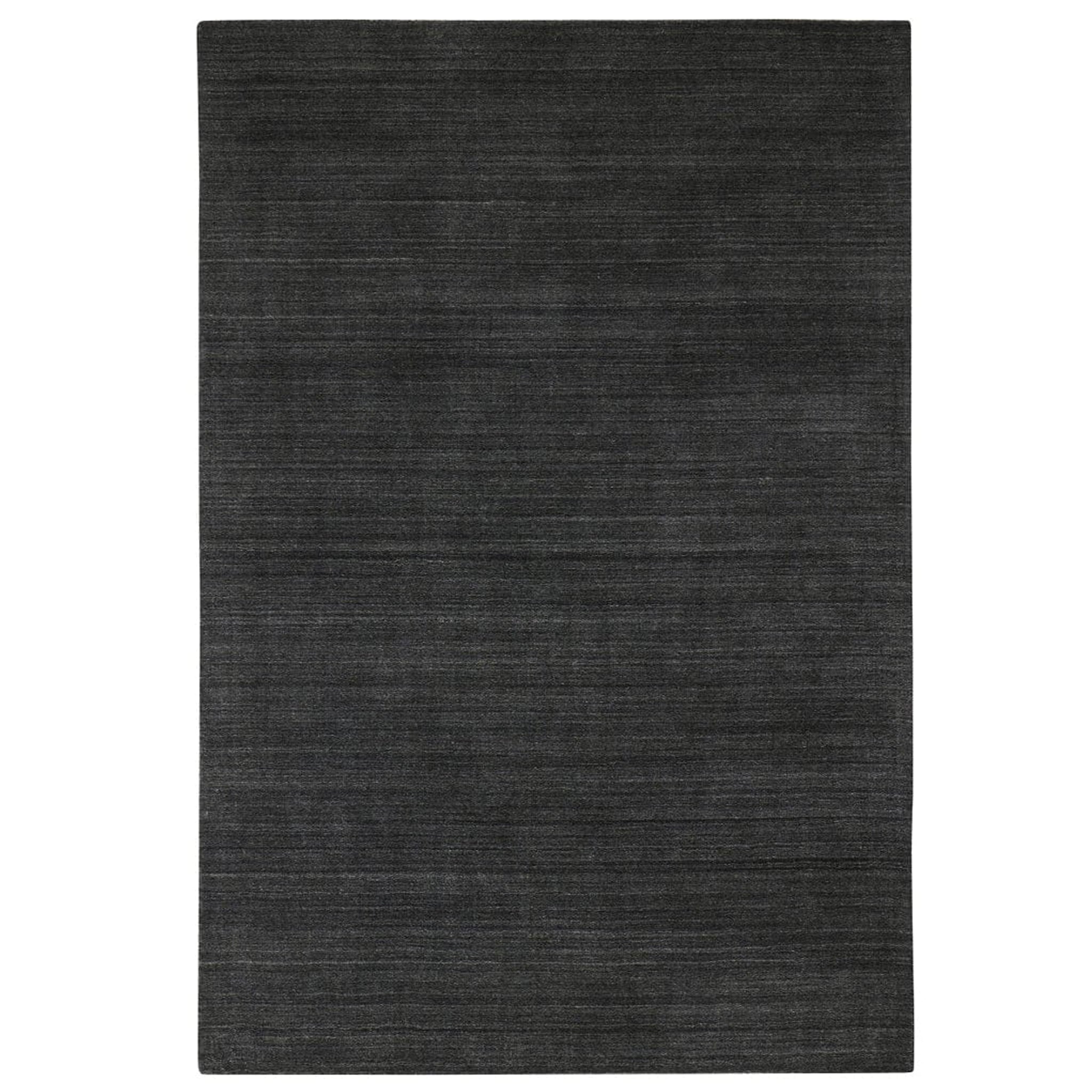 Dark gray rug on a white background