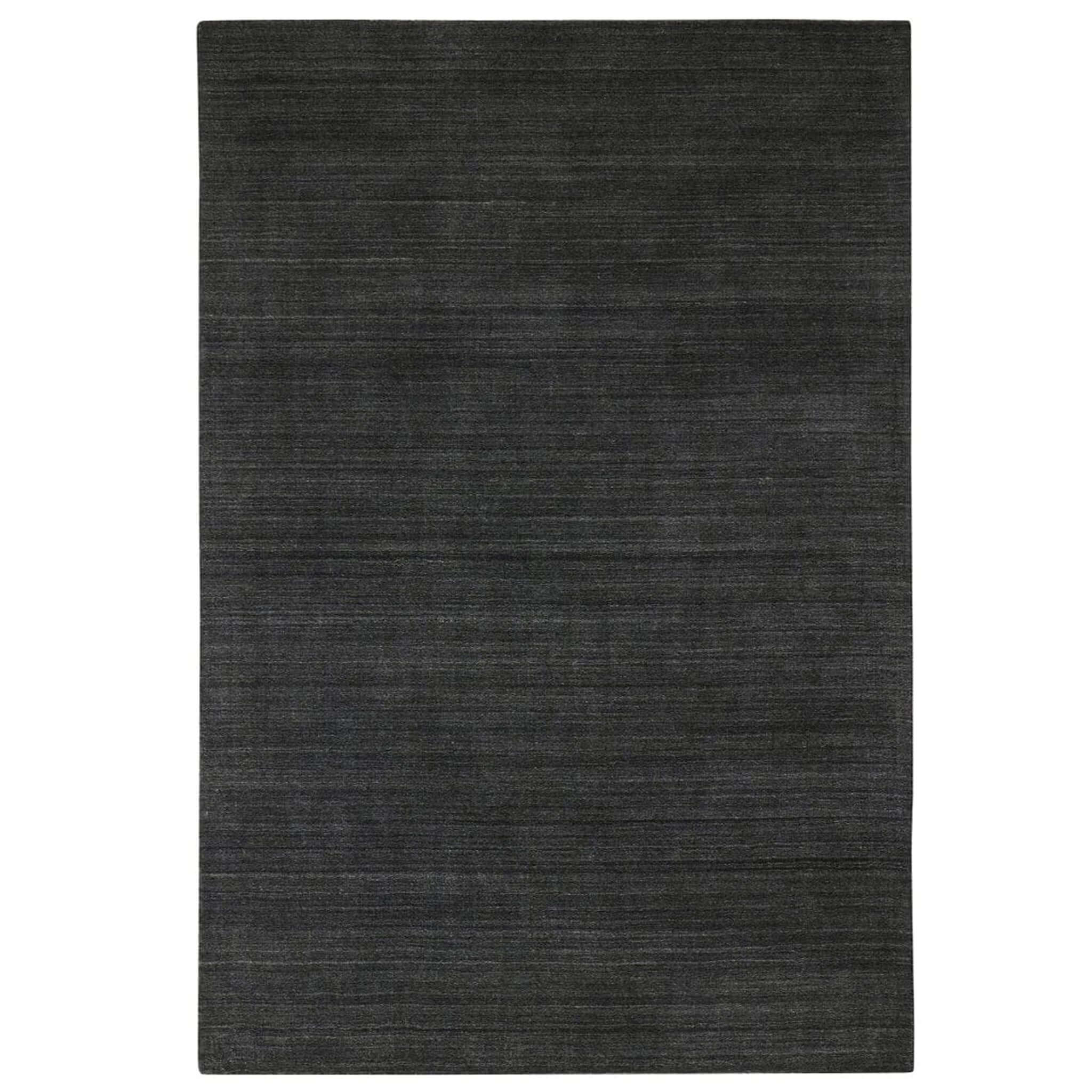 Dark gray rug on a white background