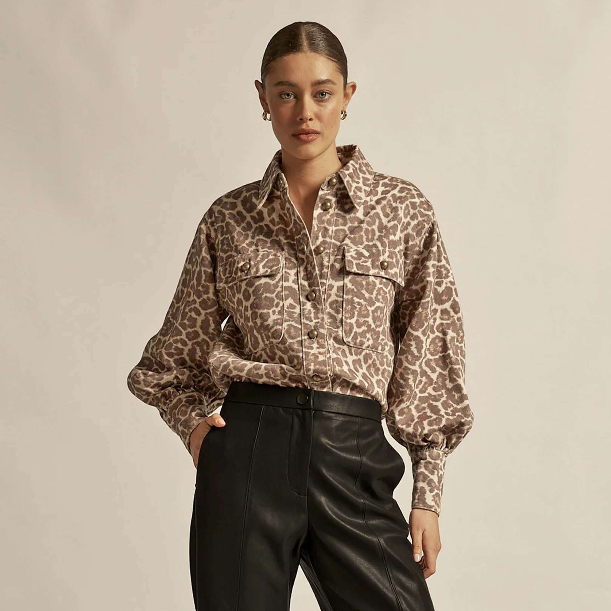 Alt Tag: Zoe Kratzmann Crest Top - Ocelot ocelot print denim-style shirt top with utility pockets, styled with black leather pants