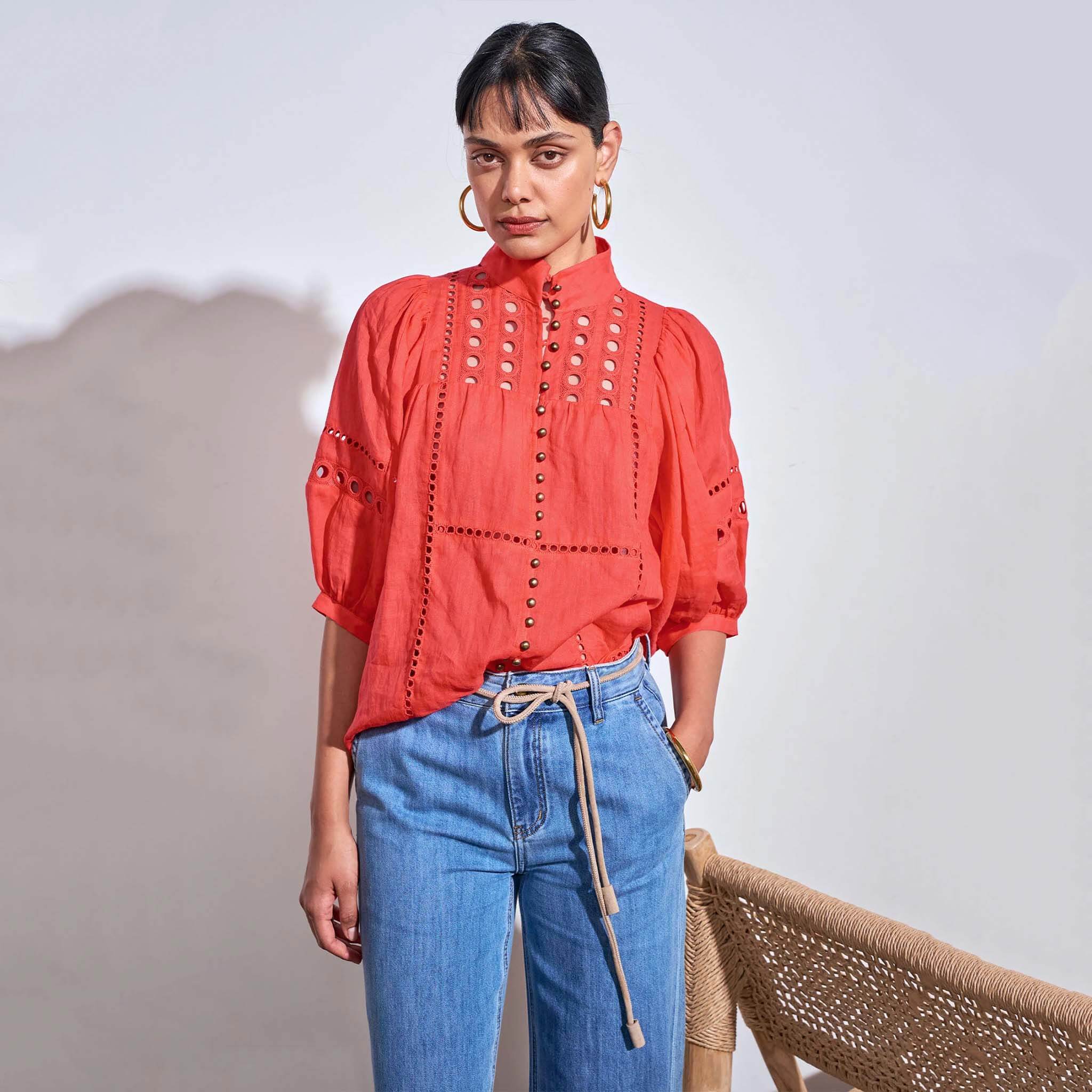 Zoe Kratzmann Extend Top - Papaya worn by model, showcasing circular eyelet inserts and antique brass buttons.