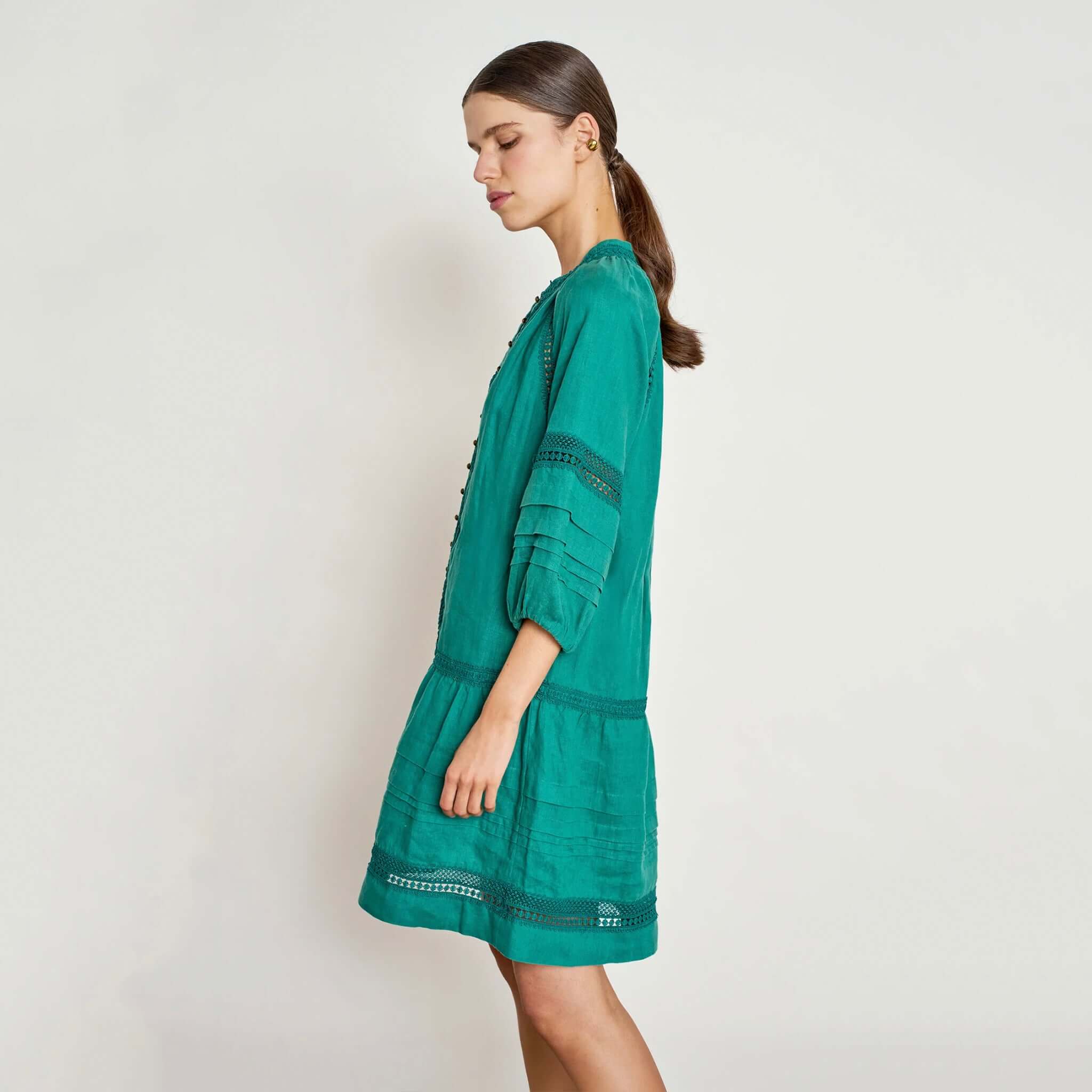 Zoe Kratzmann Jostle Dress - Cedar in a side view, featuring artisan lace inserts and a flowing silhouette.