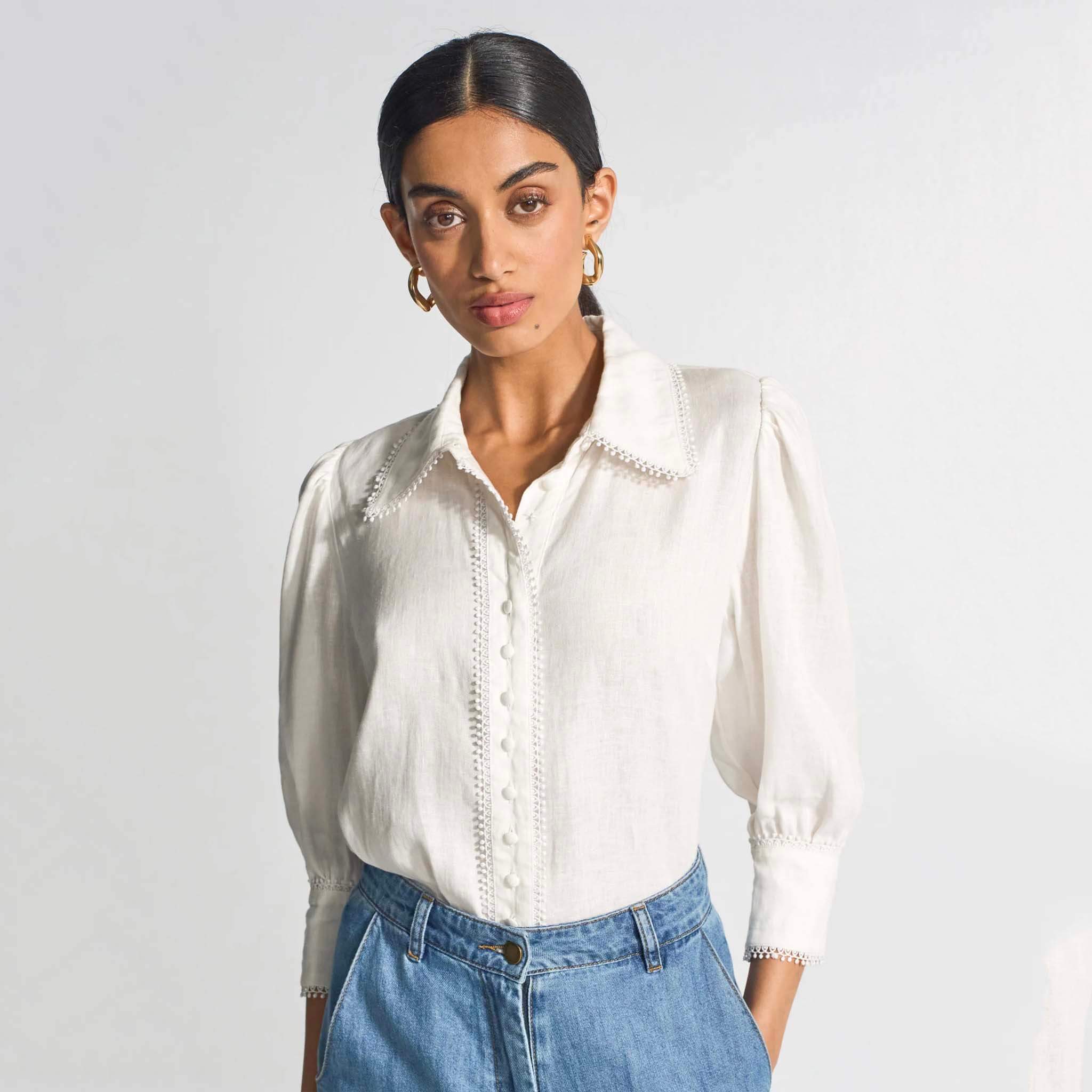 Zoe Kratzmann Serenade Top - Porcelain featuring lace trim and self-covered buttons, styled with denim.