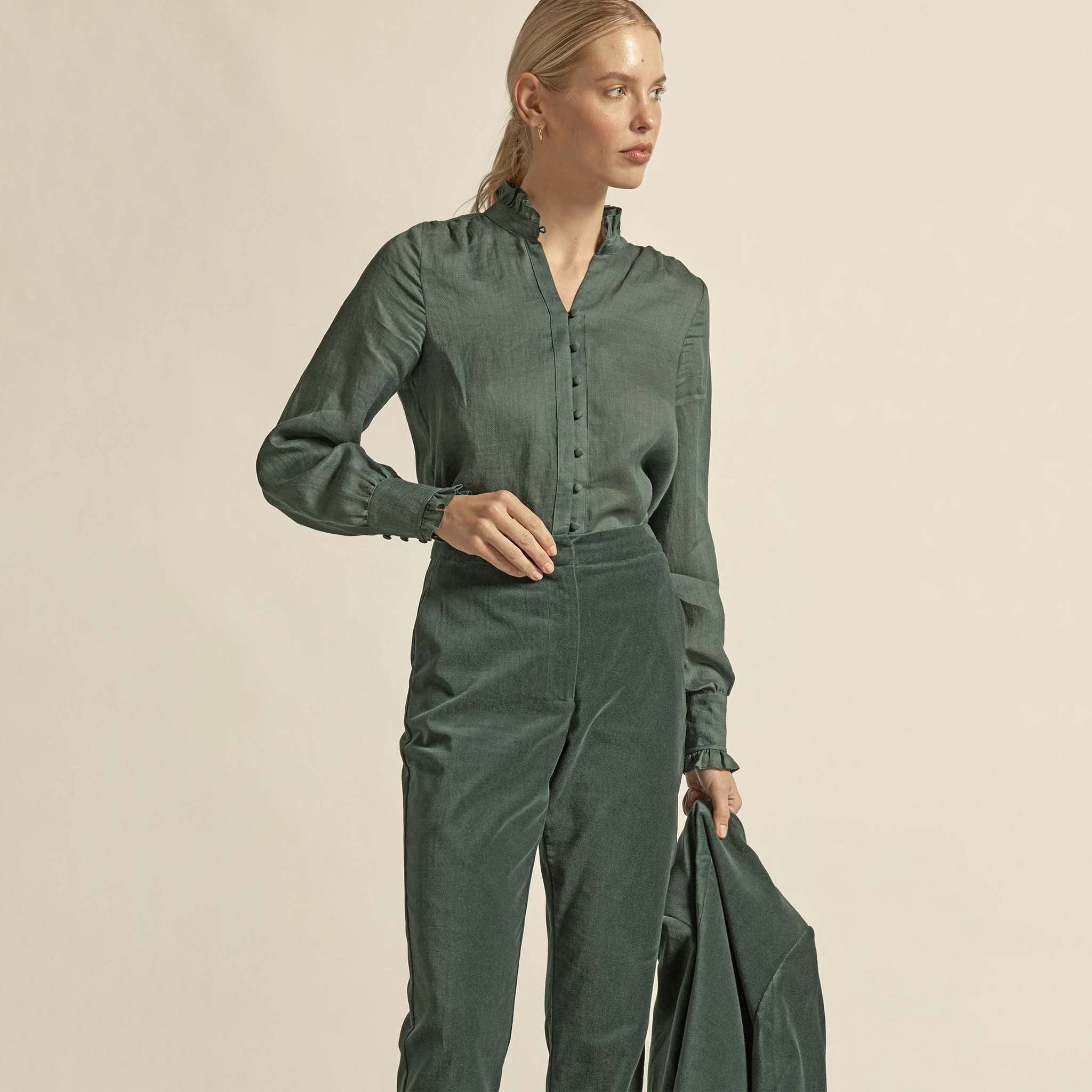 Alt Tag: Zoe Kratzmann Stir Top - Grove ruffle neck V-neck ramie blouse in grove green, styled on model