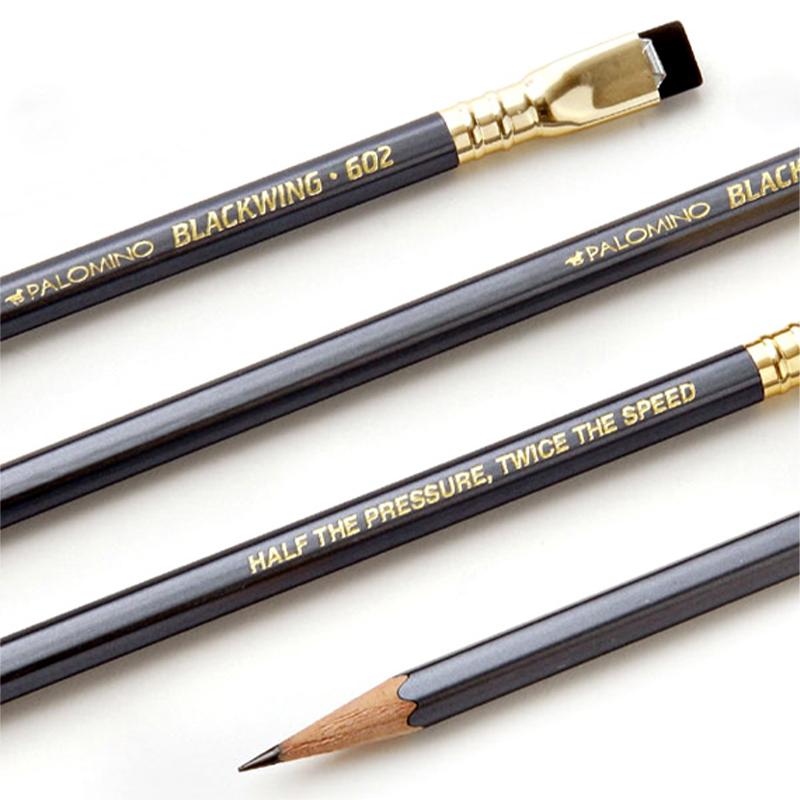 Blackwing Volume 602 Pencil close-up with gunmetal grey finish, square ferrule, pink eraser, and “Half the Pressure, Twice the Speed” imprint