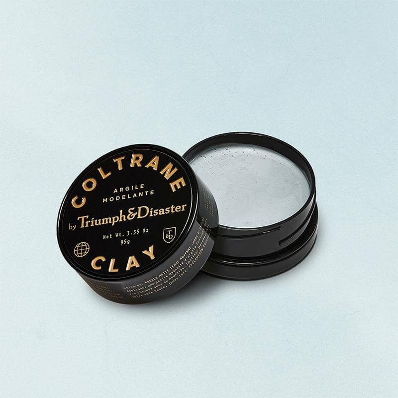 Alt Tag: Triumph & Disaster Coltrane Clay Hair Pomade open jar and lid, white clay hair styling pomade for strong hold and matte finish