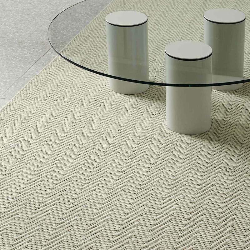 Beige rug and coffee table.