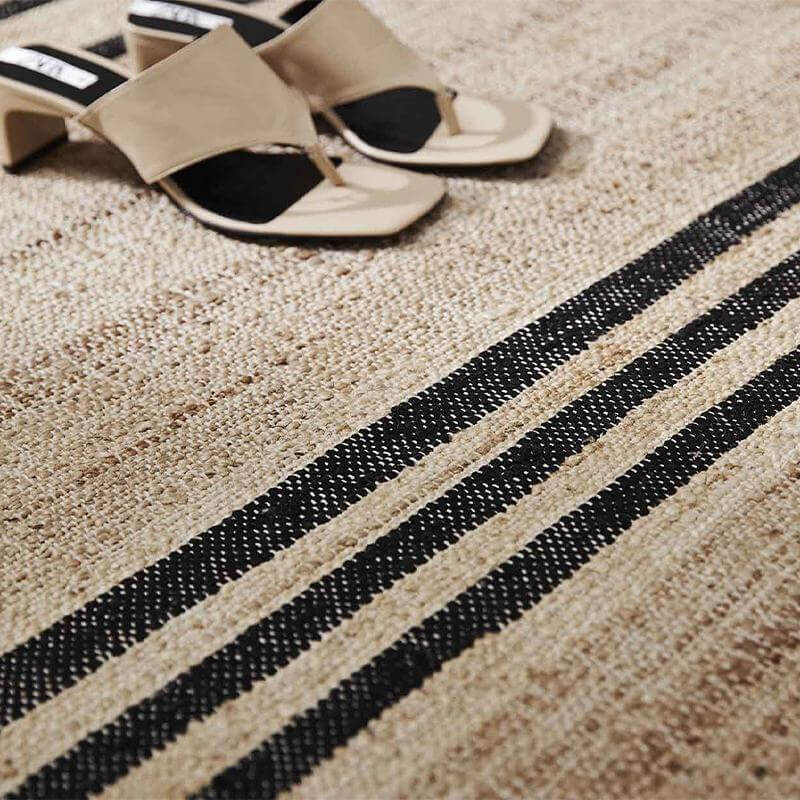 Weave Umbra Jute Rug with shoes